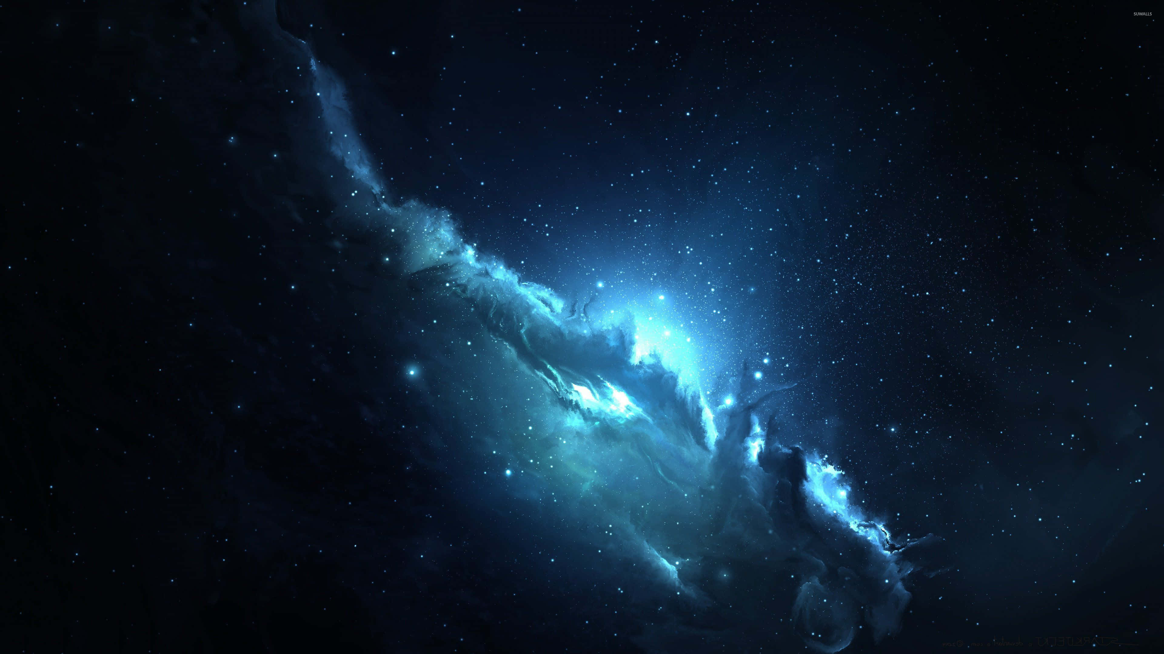 以這款精彩背景啟動藍色空間的力量 壁紙 — 一團明亮的藍色星雲在點綴著閃爍星星的黑暗宇宙中旋轉。