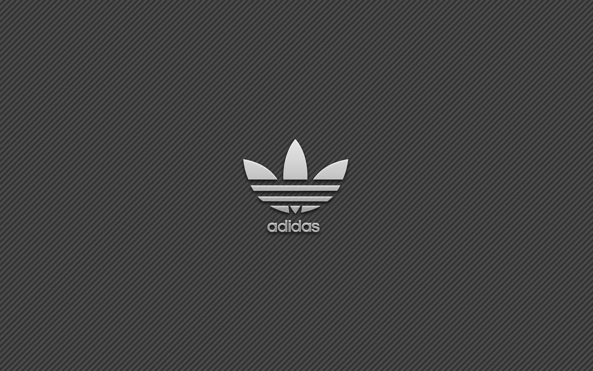 Adidas標誌在斜紋灰色背景上
