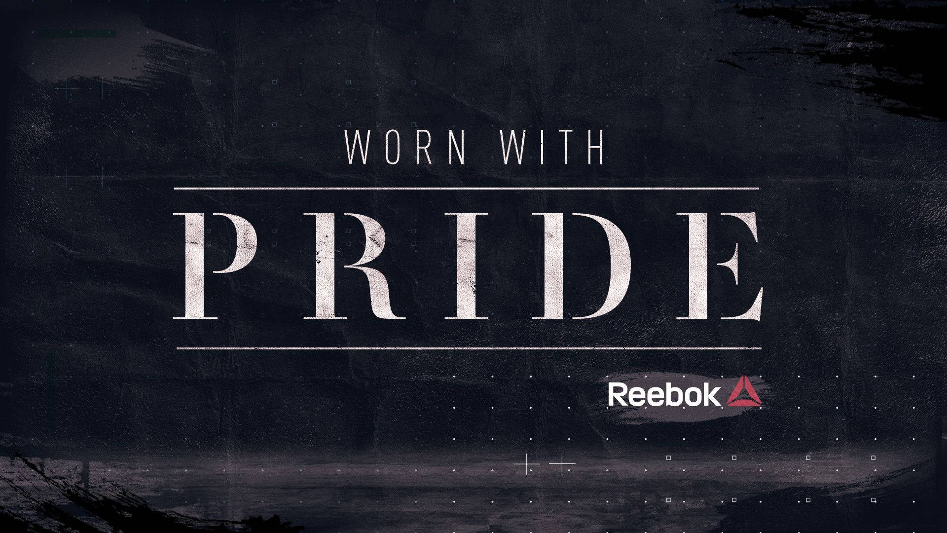 自豪地穿著文字廣告，在深色紋理背景上展示 Reebok 標誌。
