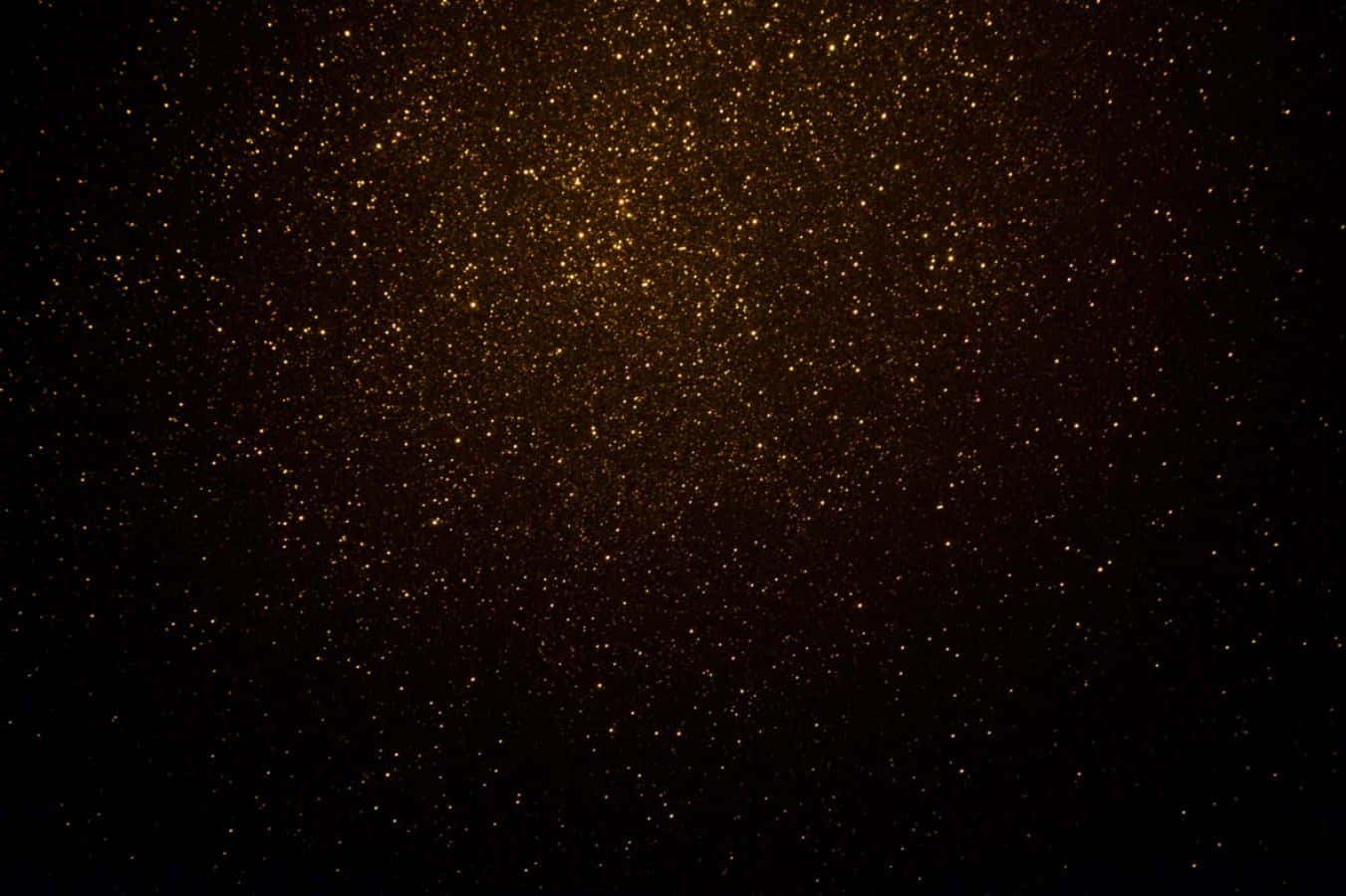 金色閃粉粒子在黑暗虛空中漂浮，如同宇宙塵雲。