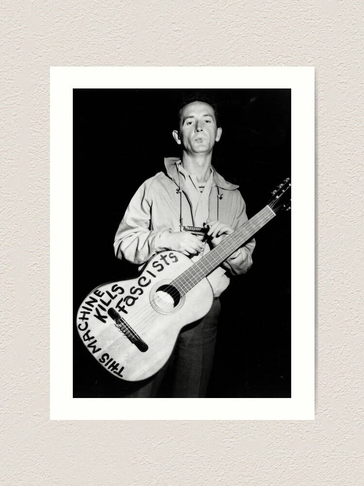 男子手持結他，琴身有「This Machine Kills Fascists」字樣 — 寶麗來 GIF 壁紙
