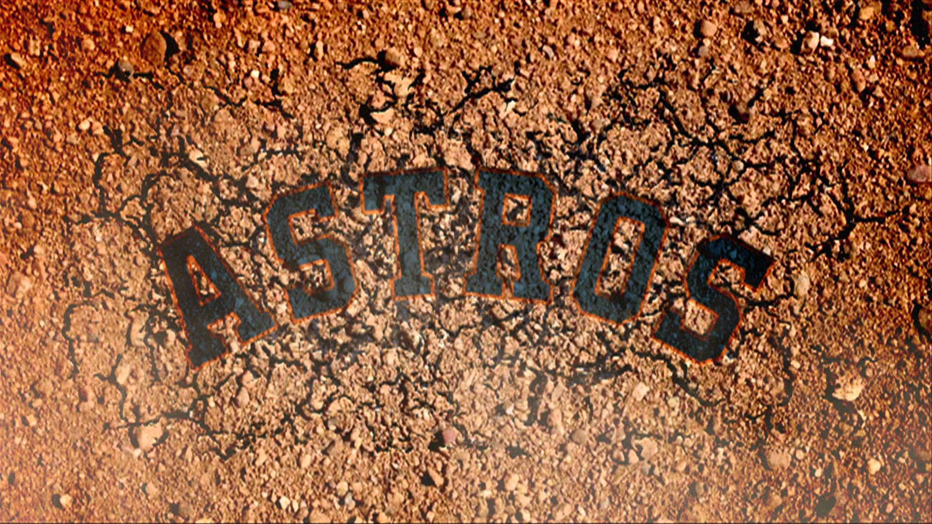 休士頓太空人乾裂大地 壁紙 — 粗體黑色 'ASTROS' 字母嵌入裂開的紅褐色泥土中，帶有粗糙質感。