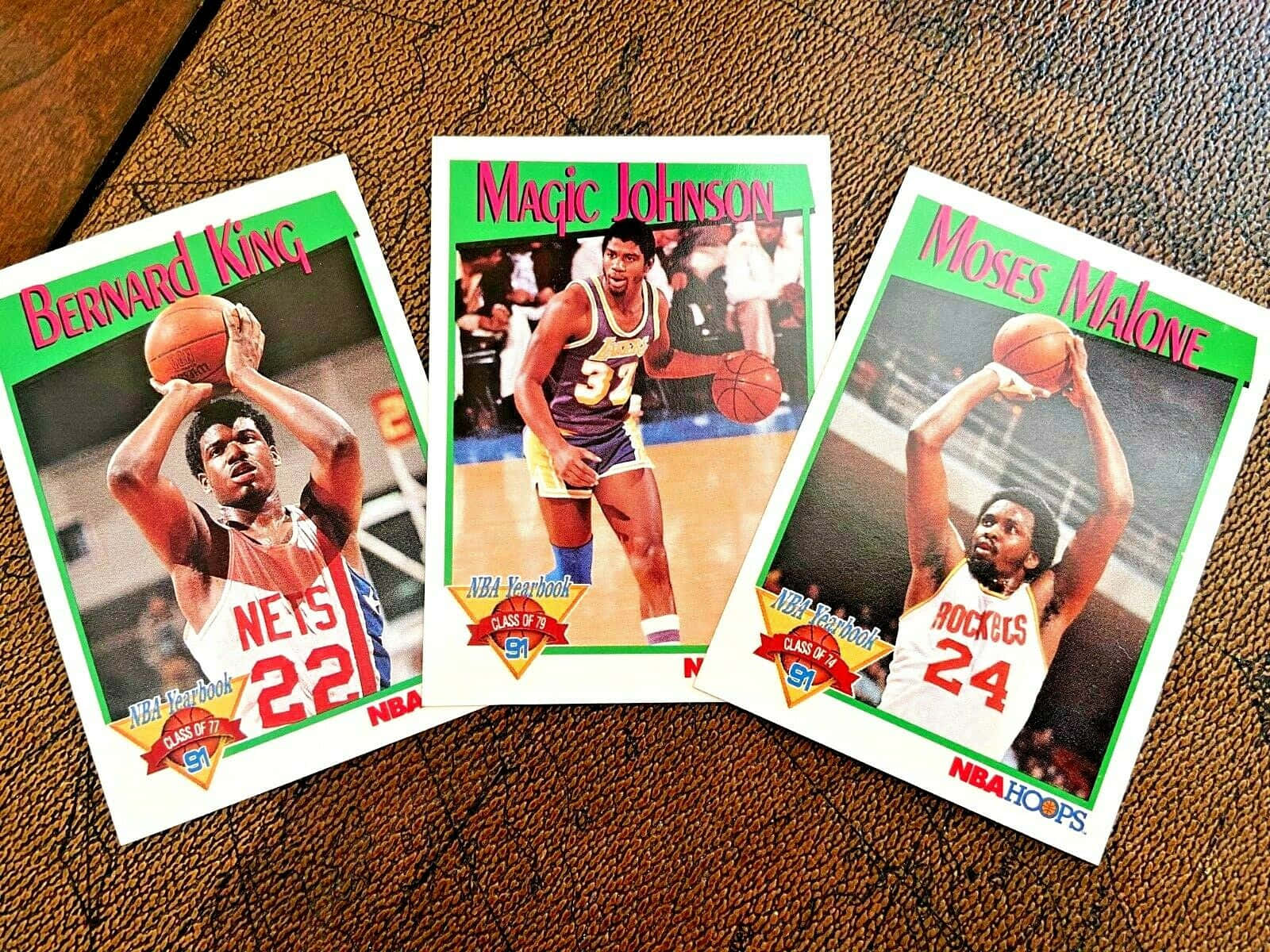 三張1991年NBA交易卡， featuring Bernard King、Magic Johnson和Moses Malone。