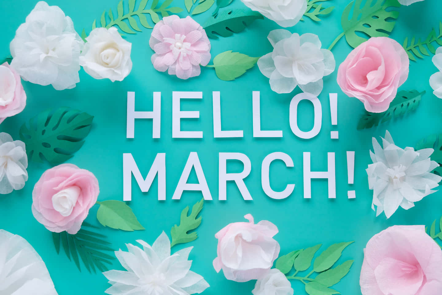 Hello March 文字被紙花和樹葉環繞在青綠色背景上