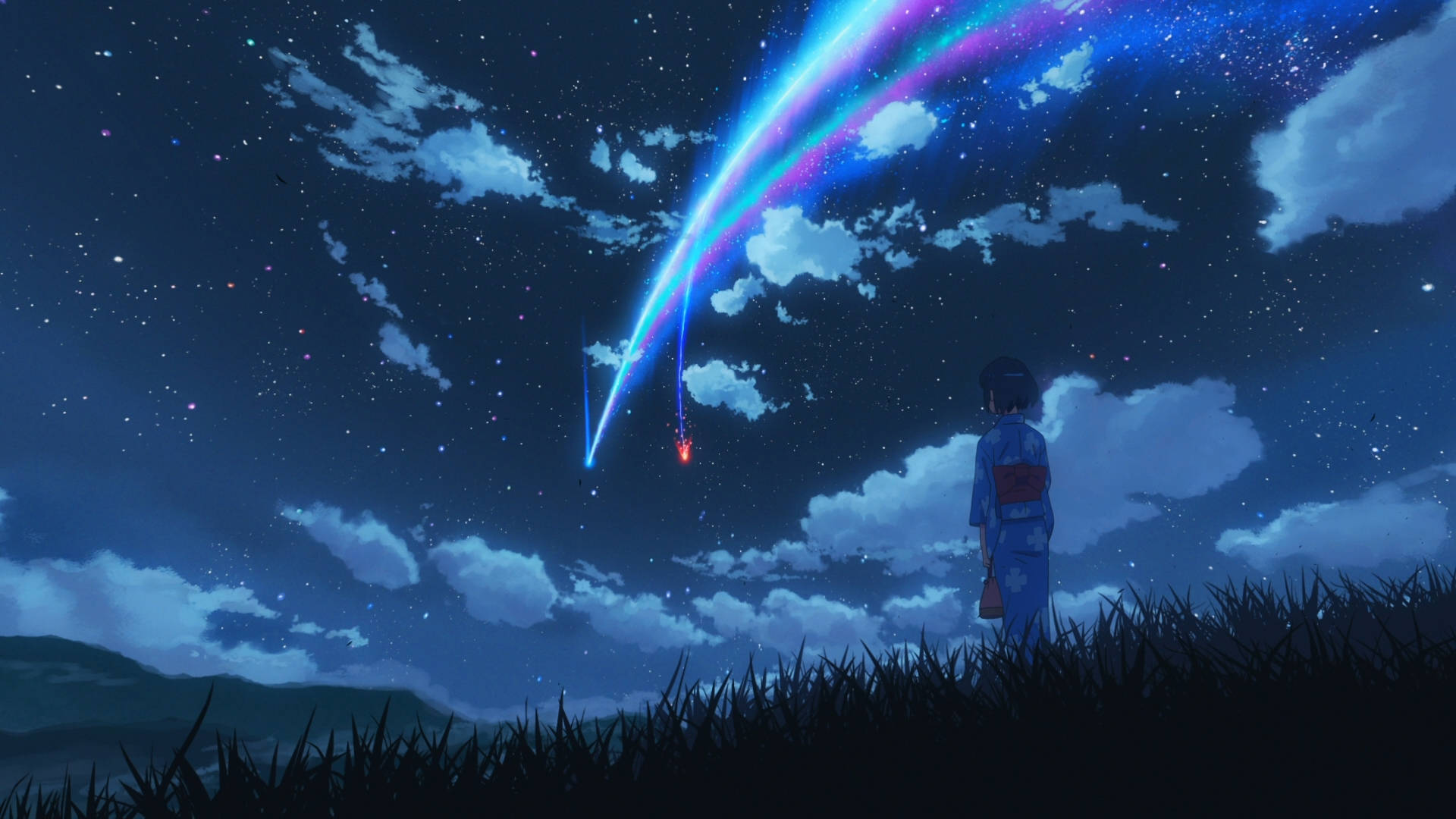 穿著和服的女孩在星空夜空中觀看一顆色彩繽紛的流星。