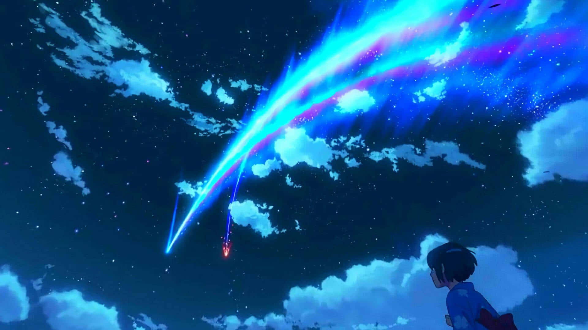 女孩看著一顆發光的彗星在星空中劃出弧線。