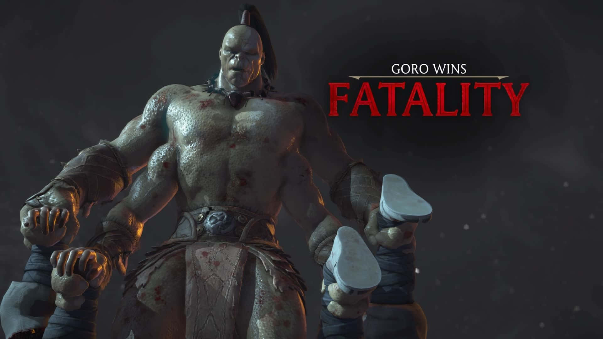 Mortal Kombat Goro 桌布 壁紙 — 來自《真人快打》的肌肉發達、血跡斑斑的Goro勝利地站著，身後有『Goro Wins Fatality』文字發出紅光。