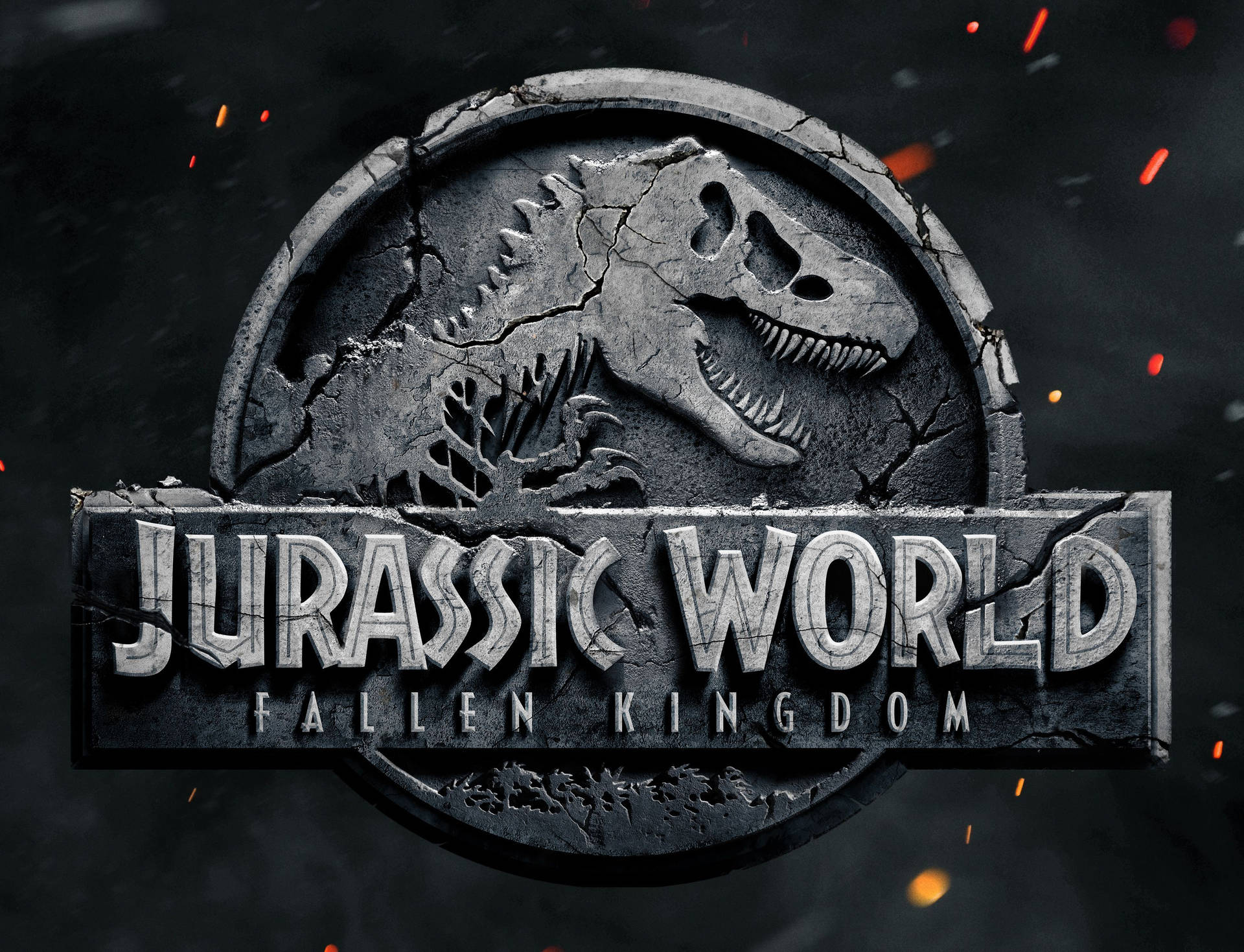 Jurassic World: 殞落國度標誌，裂開的石頭和飛舞的火星。