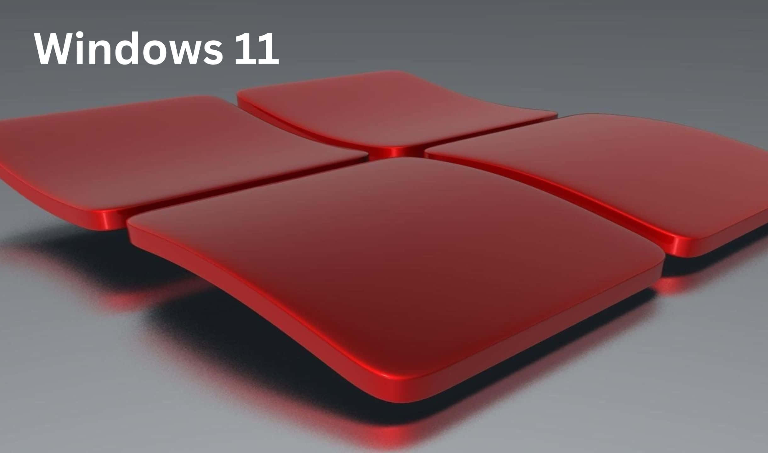 四個紅色圓角正方形在灰色背景上形成Windows 11標誌。