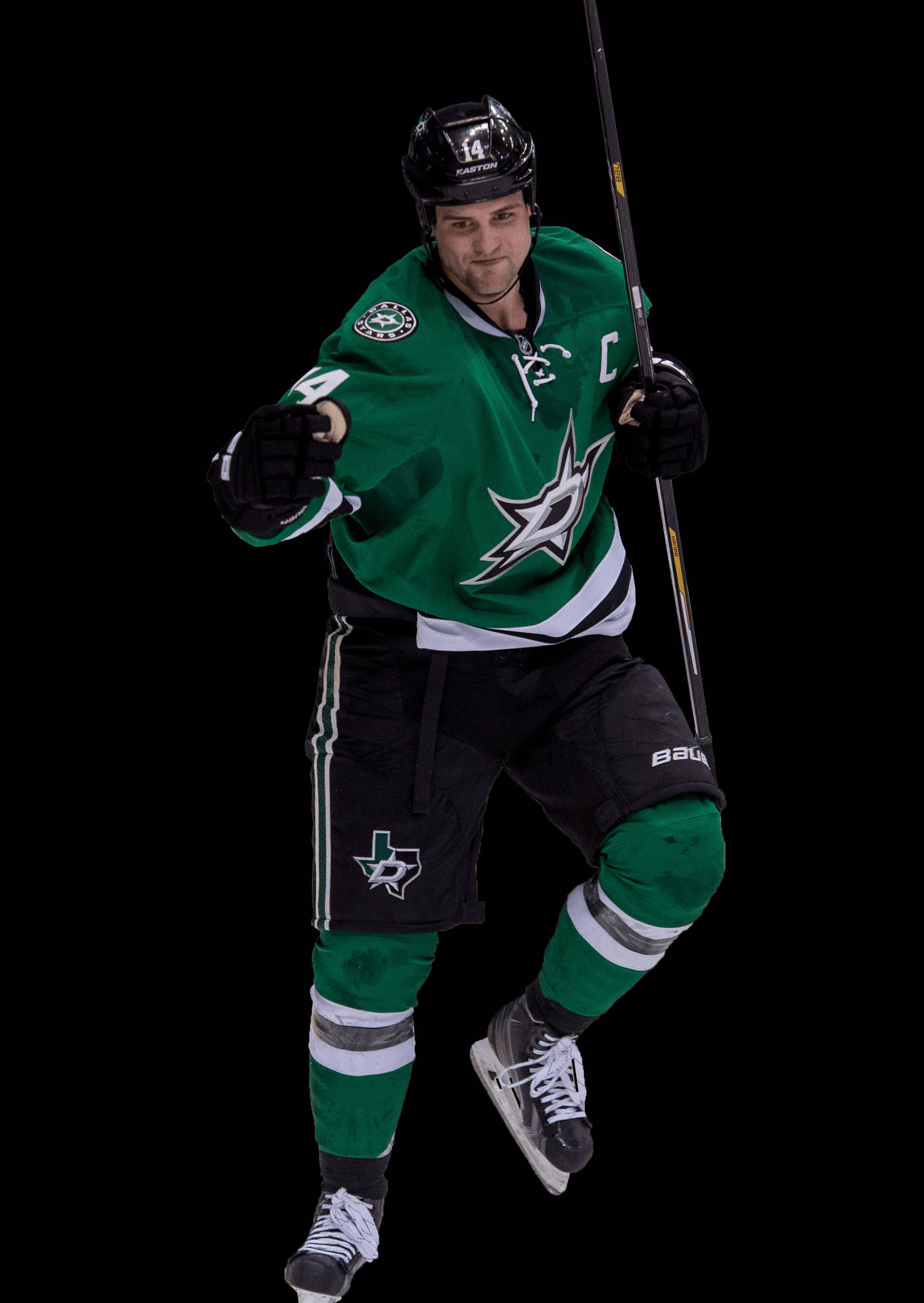 傑米·本恩 - NHL 达拉斯星隊的強力核心 壁紙 — 一名身穿綠色和黑色球衣的曲棍球運動員在黑色背景下，跨步中握著球棍。