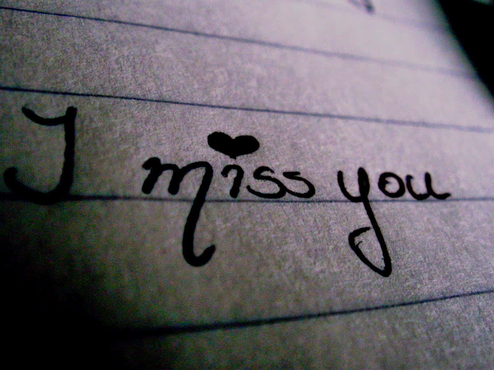 橫線紙上手寫訊息，寫著 I miss you，並有一顆心。