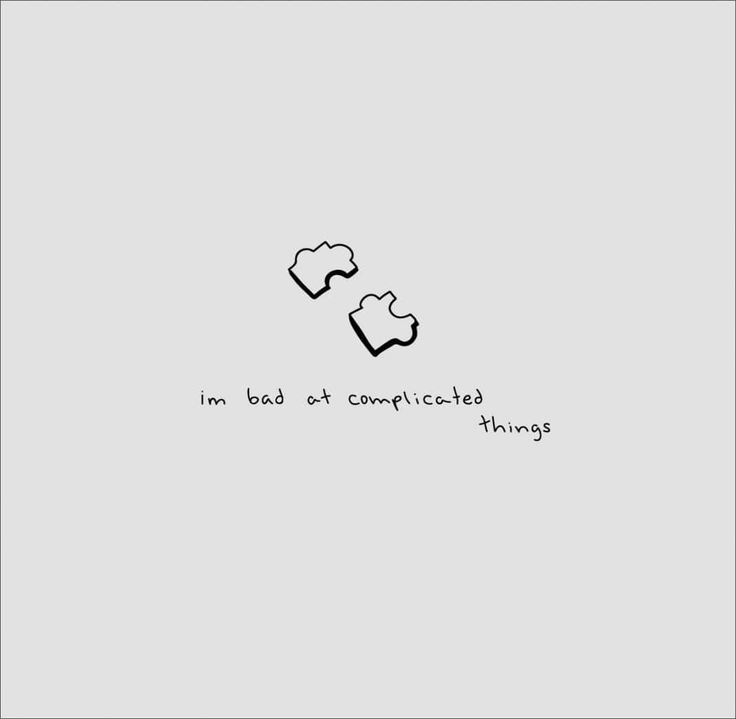 兩個拼圖碎片喺手寫風格嘅句子「im bad at complicated things」上面。