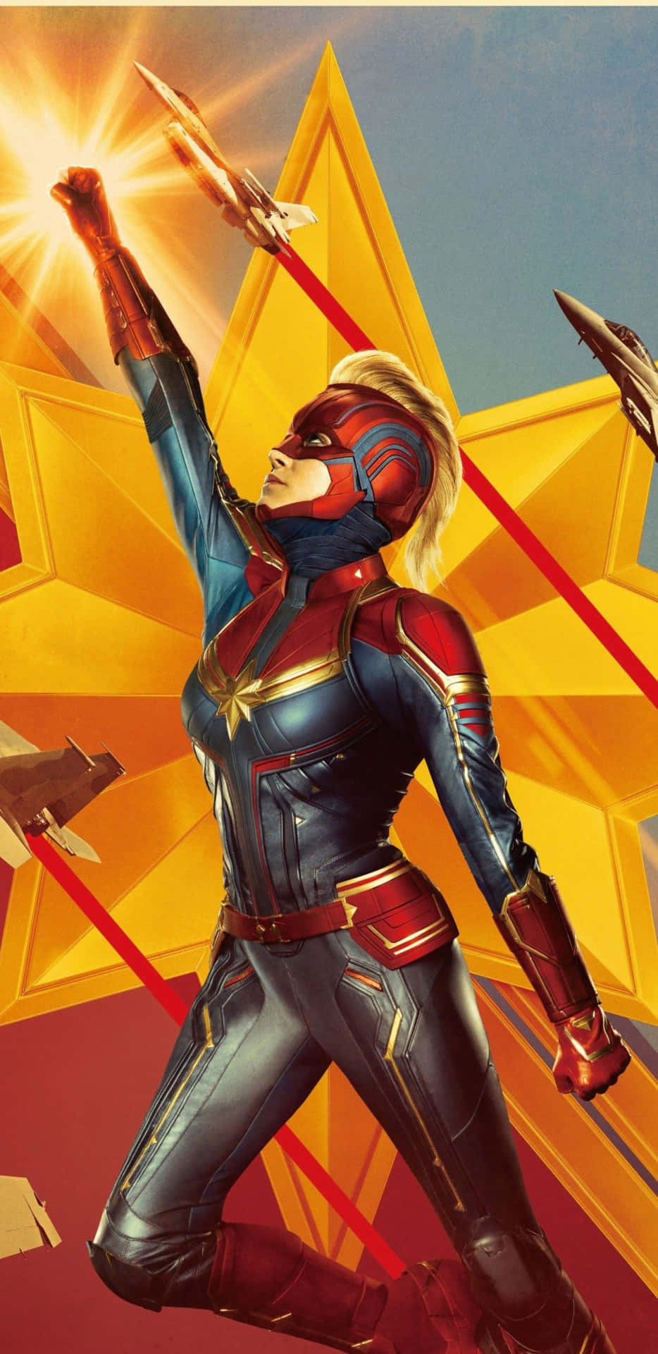 身穿戰衣的 Captain Marvel 舉起拳頭，戰鬥機圍繞金色星星飛行。