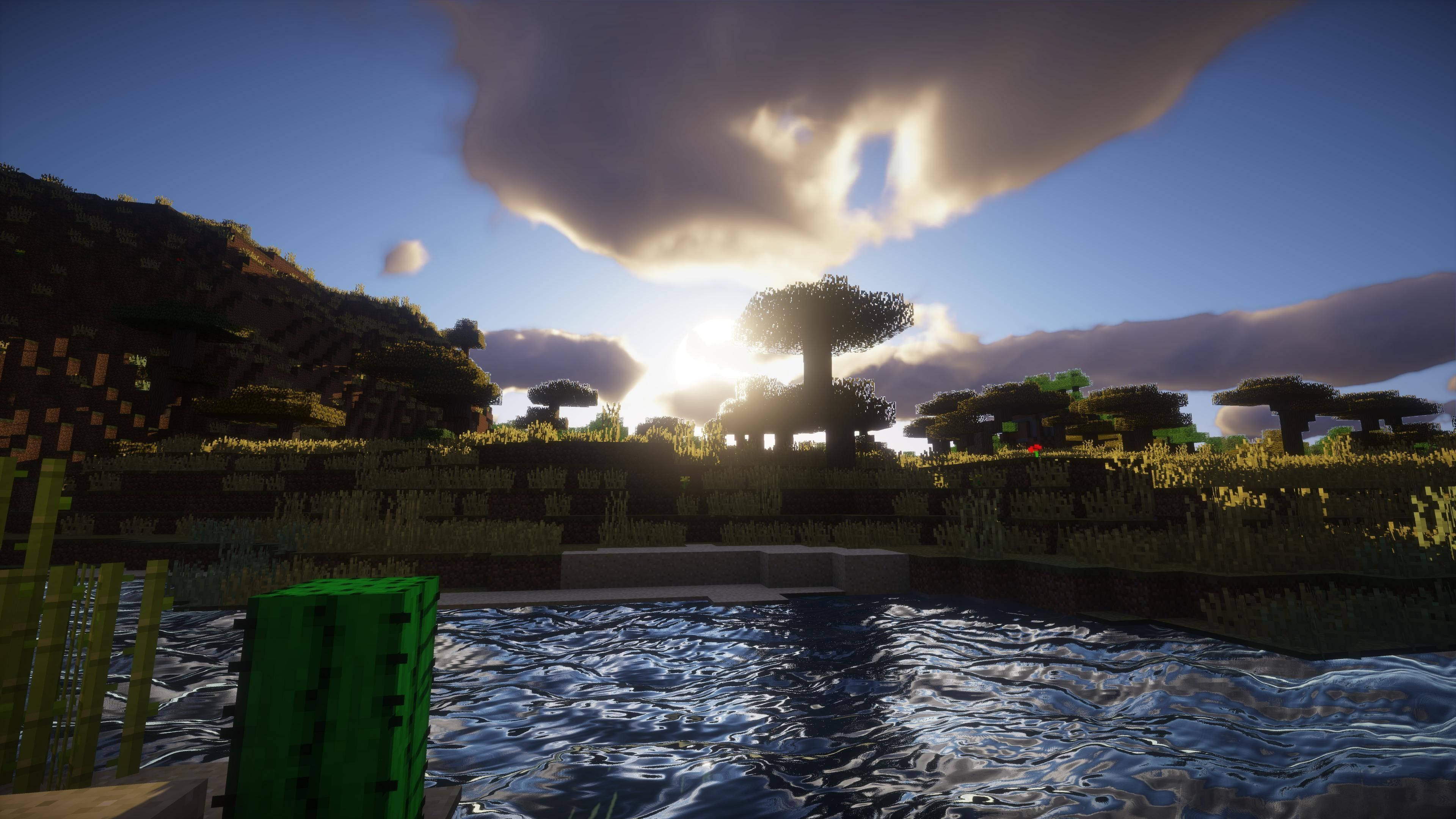 藍天 桌布 壁紙 — 像素風格渲染的Minecraft方塊地形，有樹木、水和山丘，夕陽西下。