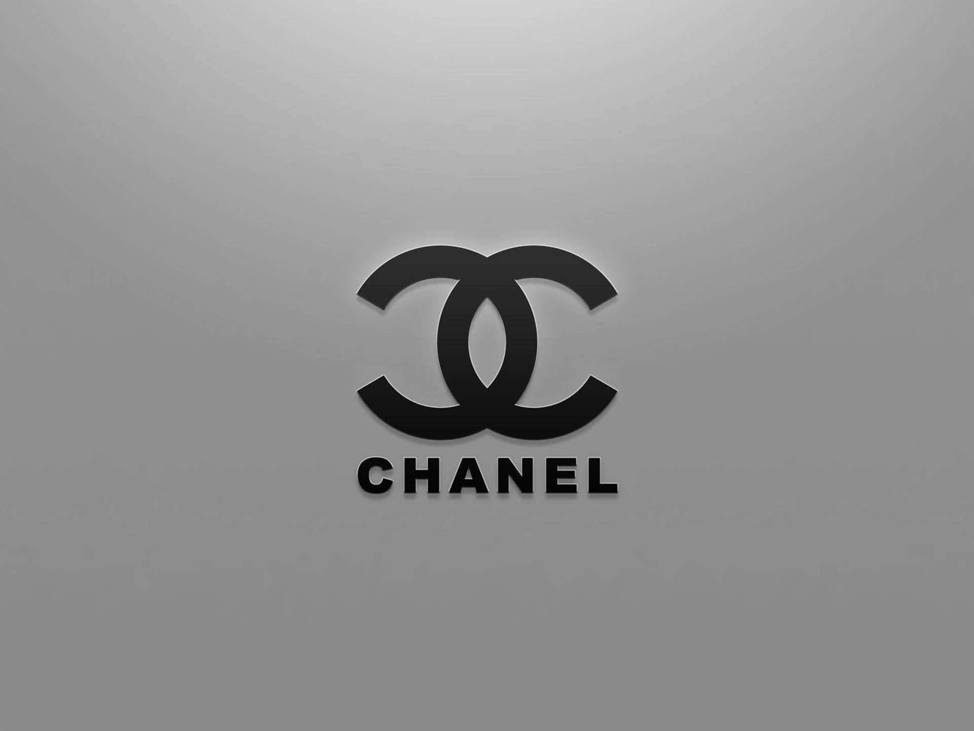 灰色漸變背景上的黑色Chanel標誌