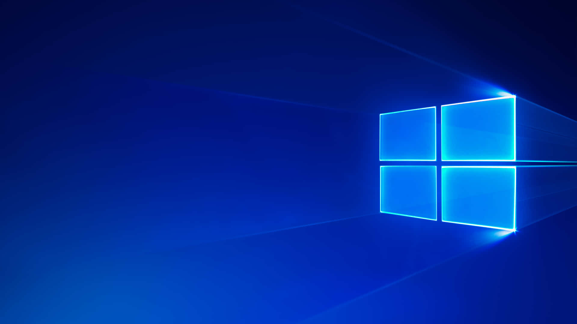 發光的藍色Windows標誌，在深藍色背景上帶有光線。 — 簡約 壁紙