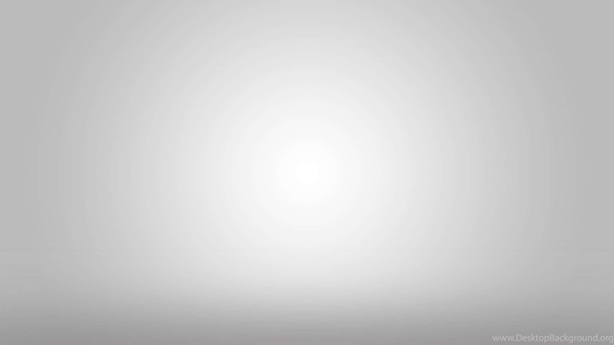 優雅灰階漸層背景 壁紙 — 一個極簡漸變背景，從中心散發出柔和的白光，延伸至柔和的灰色邊緣。