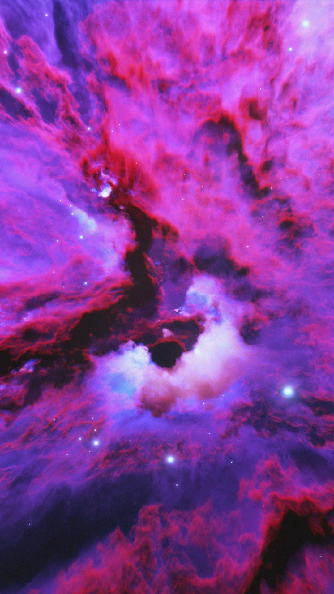 星雲 桌布 壁紙 — 充滿活力的宇宙星雲以電光粉紅、紫色和藍色旋轉，閃爍的星星散落在深邃的太空廣袤中。