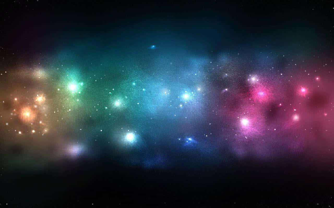 銀河系 桌布 壁紙 — 充滿活力的宇宙星雲在繁星點點的黑色虛空中散發出藍綠色、粉紅色和金色的光芒。