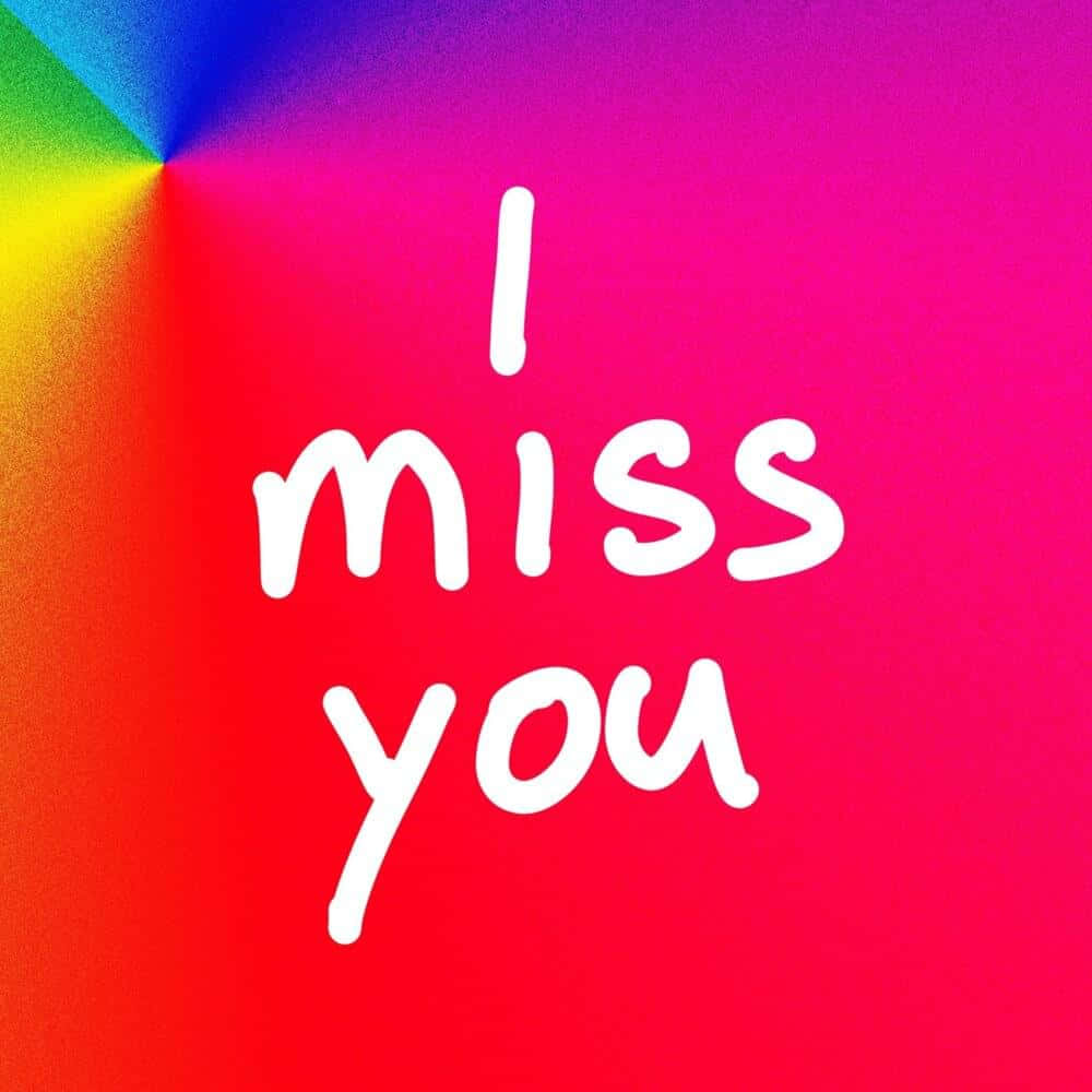 I Miss You 桌布 壁紙 — 充滿活力的彩虹漸變背景，中央有白色手寫文字「我想你」。