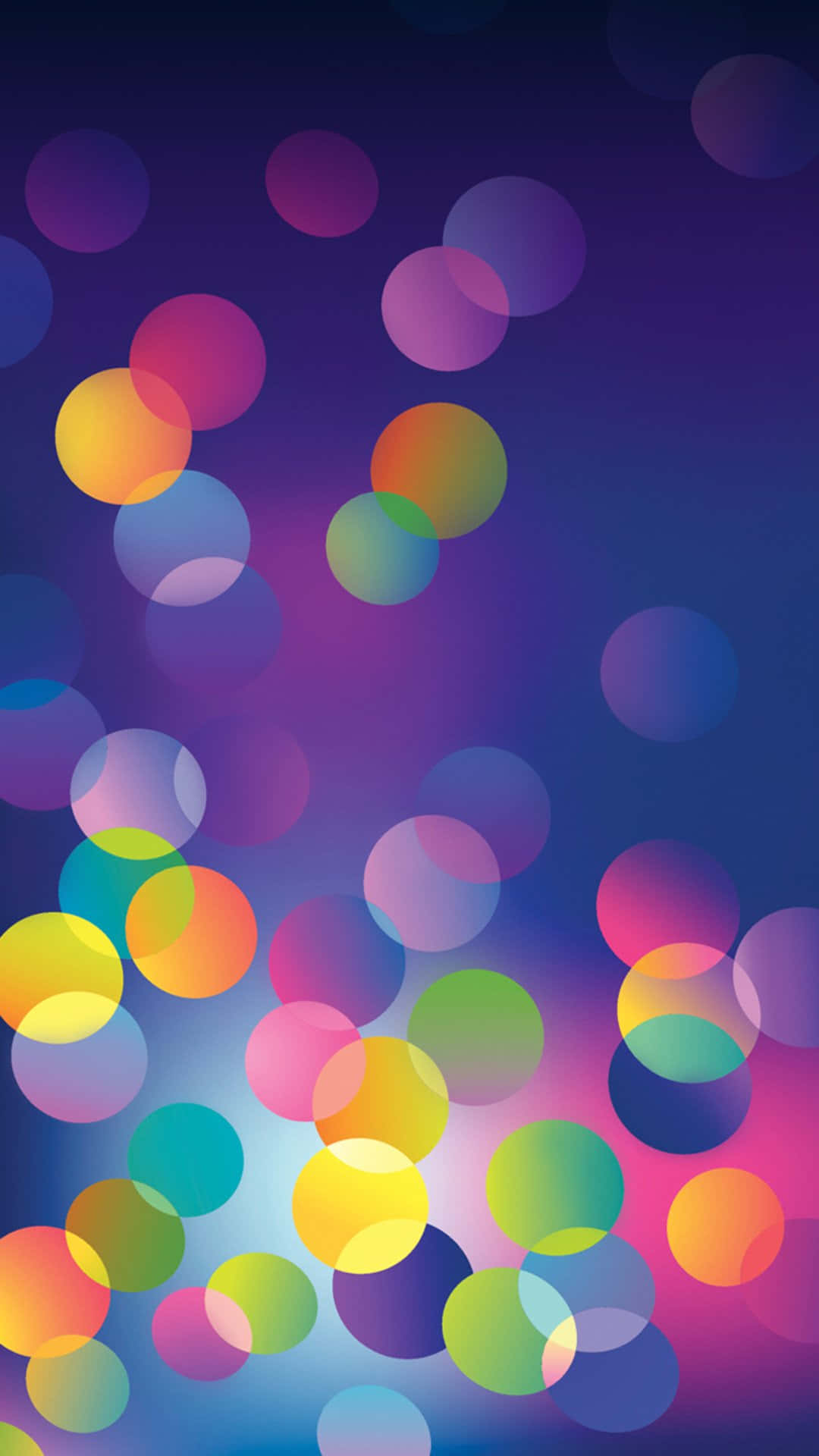 Mix Color 桌布 壁紙 — 充滿活力的彩虹色重疊圓圈柔和地漂浮在漸變紫藍色背景上。