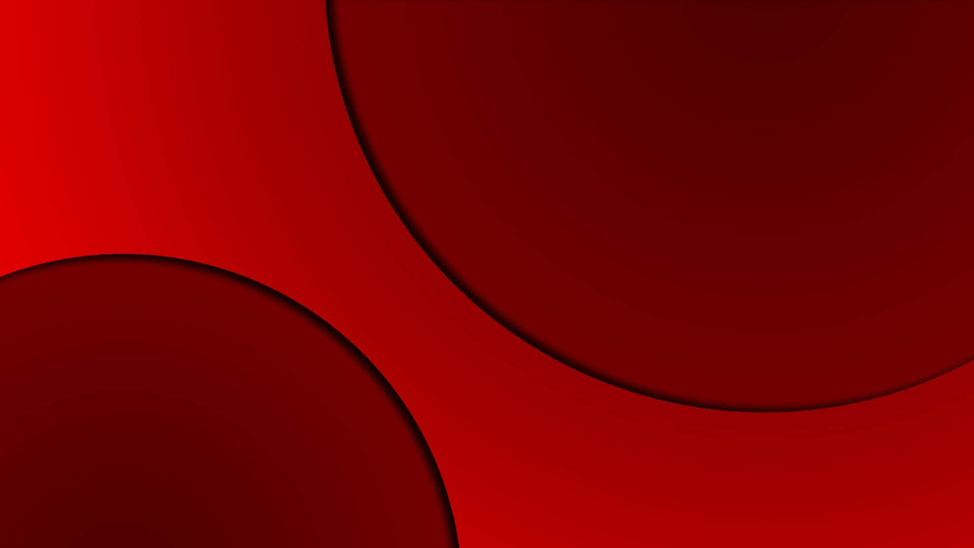 Solid Red 桌布 壁紙 — 充滿活力的抽象紅色圓圈，帶有漸變陰影，漂浮在濃郁的深紅色背景上。