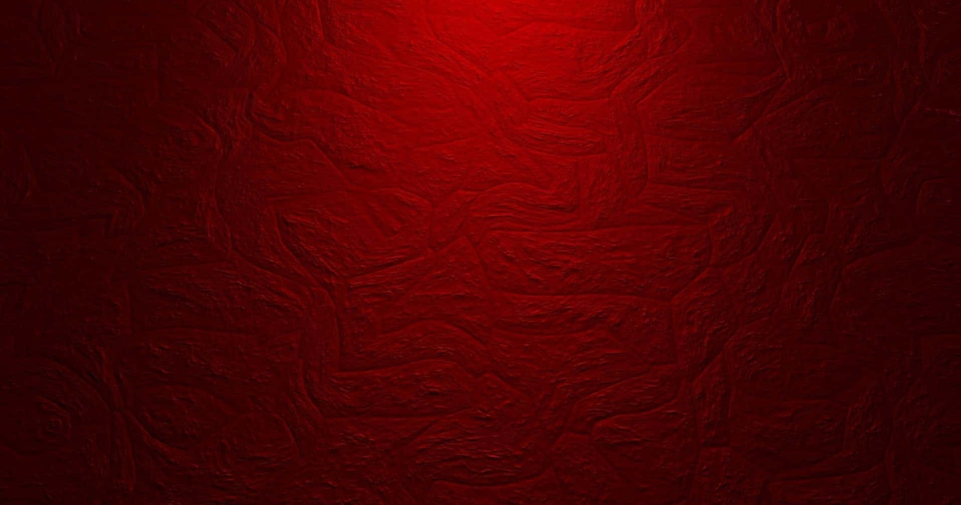 充滿活力的抽象紅色背景，高解析度 壁紙 — 一個質感豐富的紅色表面，帶有漩渦圖案和從中心到邊緣的發光漸變。