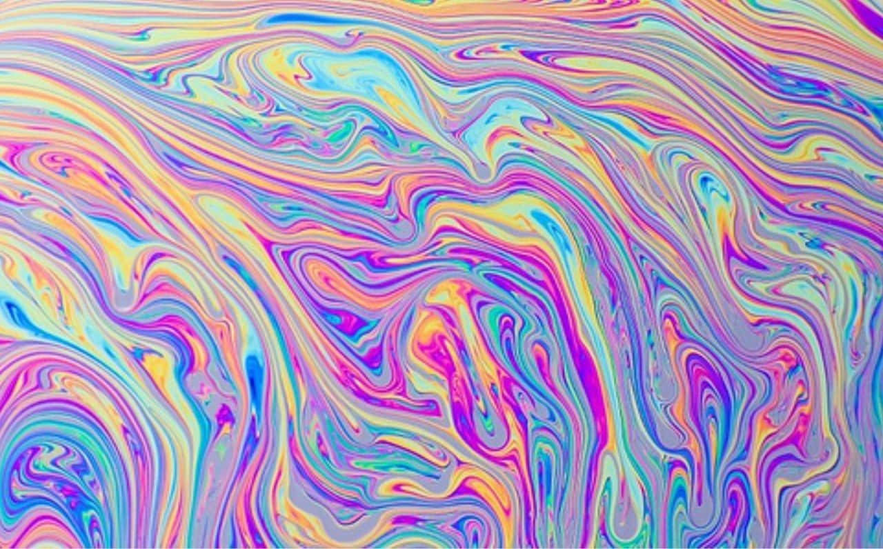 Mix Color 桌布 壁紙 — 充滿活力的旋轉彩虹色彩如液體顏料般流動，形成迷人的抽象圖案。