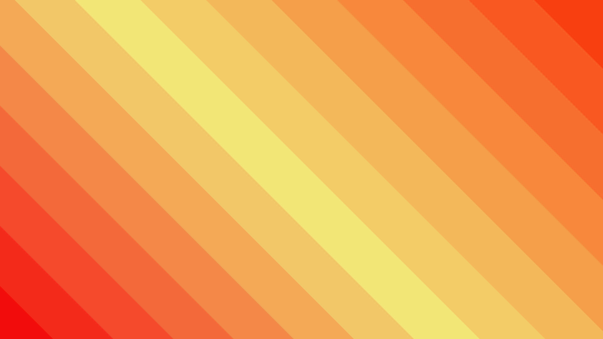Orange And Yellow 桌布 壁紙 — 充滿活力的暖橙色、黃色和紅色對角條紋，營造出大膽的抽象漸變背景。