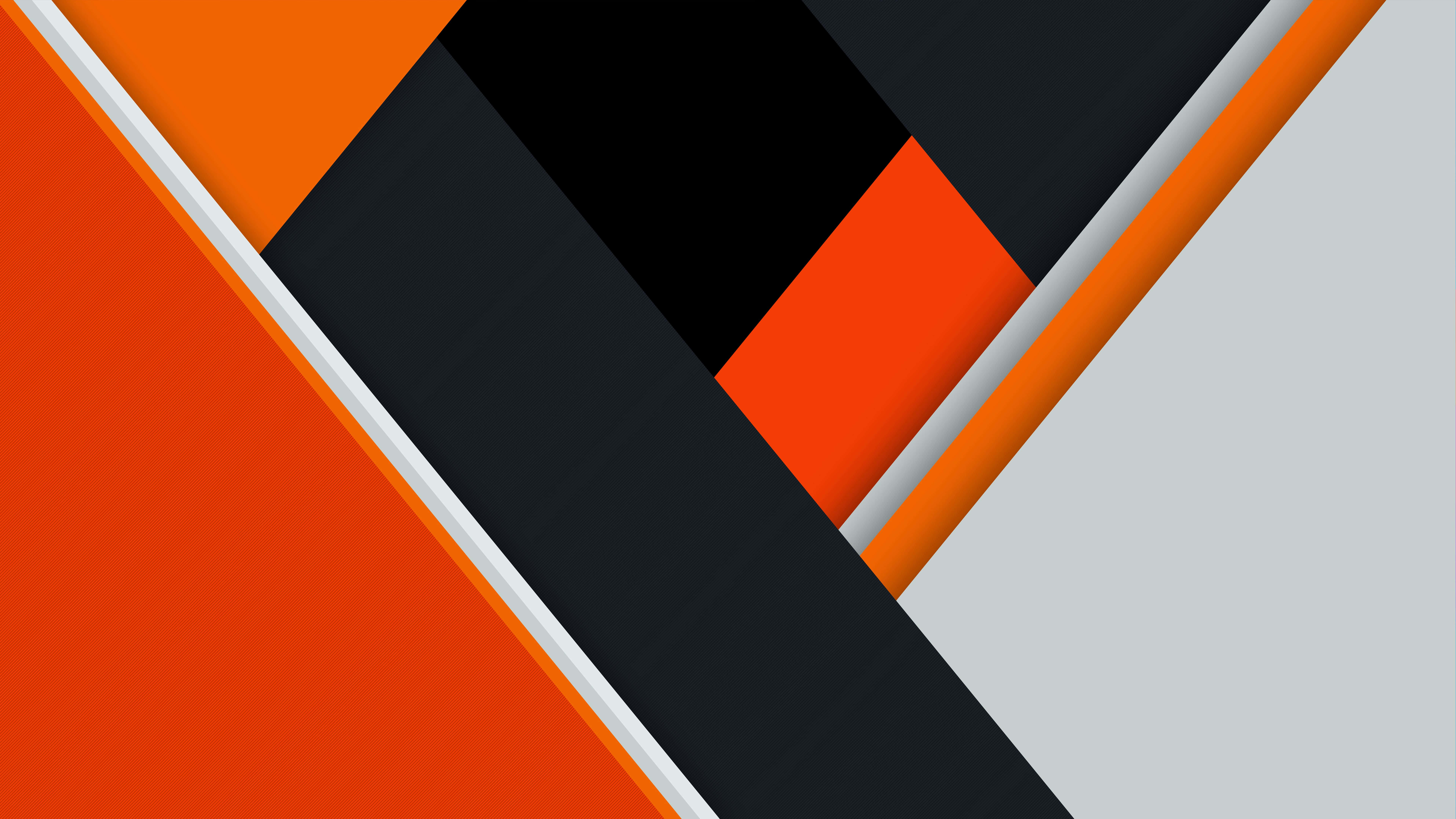 Black And Orange 桌布 壁紙 — 充滿活力的橙色、黑色和灰色幾何形狀形成動態的對角線圖案，邊緣乾淨銳利。