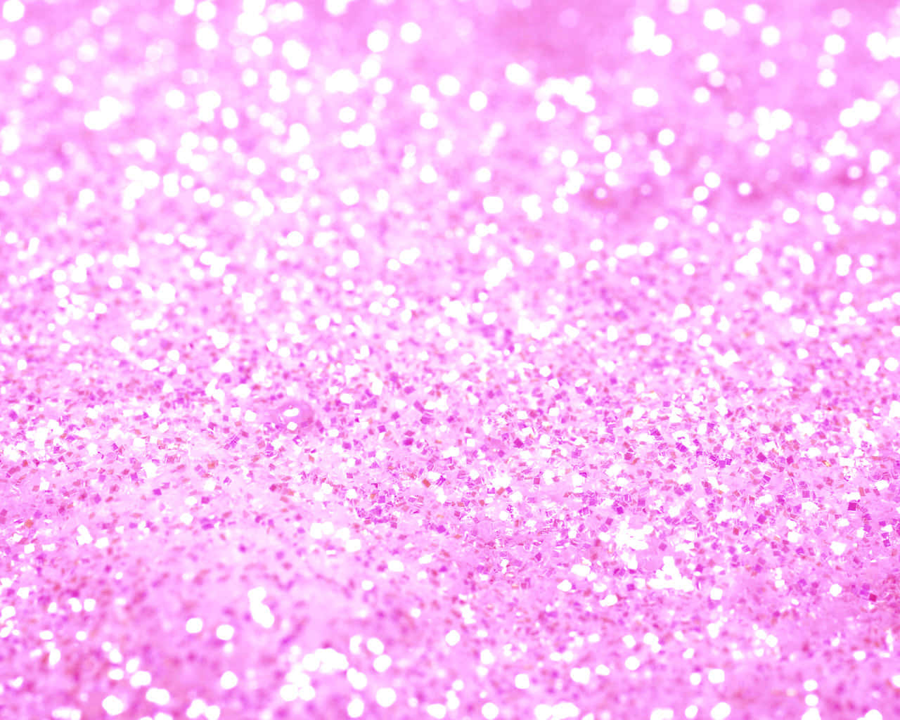Pink Sparkles 桌布 壁紙 — 充滿活力的粉紅色閃粉特寫，帶有閃爍的白色亮點，營造出閃閃發光的紋理表面。