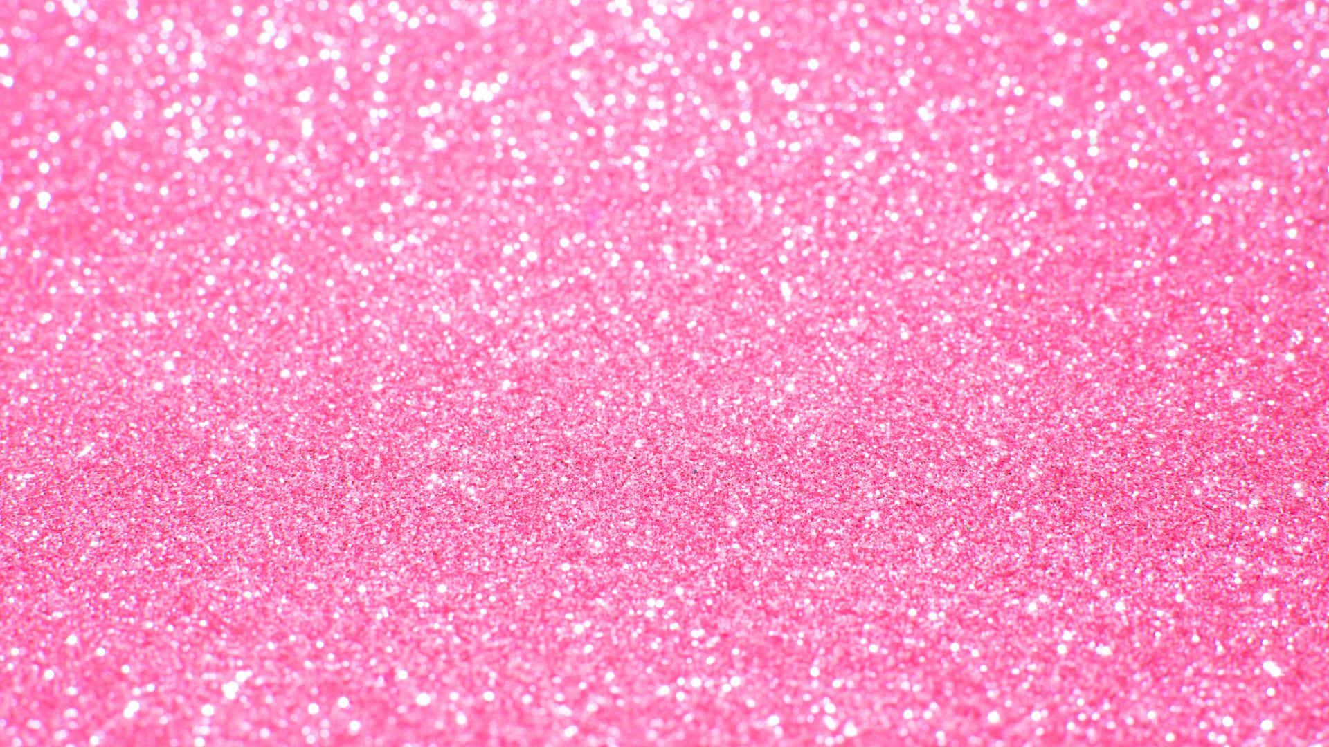 Pink Sparkles 桌布 壁紙 — 充滿活力的粉紅色閃粉紋理，帶有閃爍的白色斑點覆蓋整個畫面。