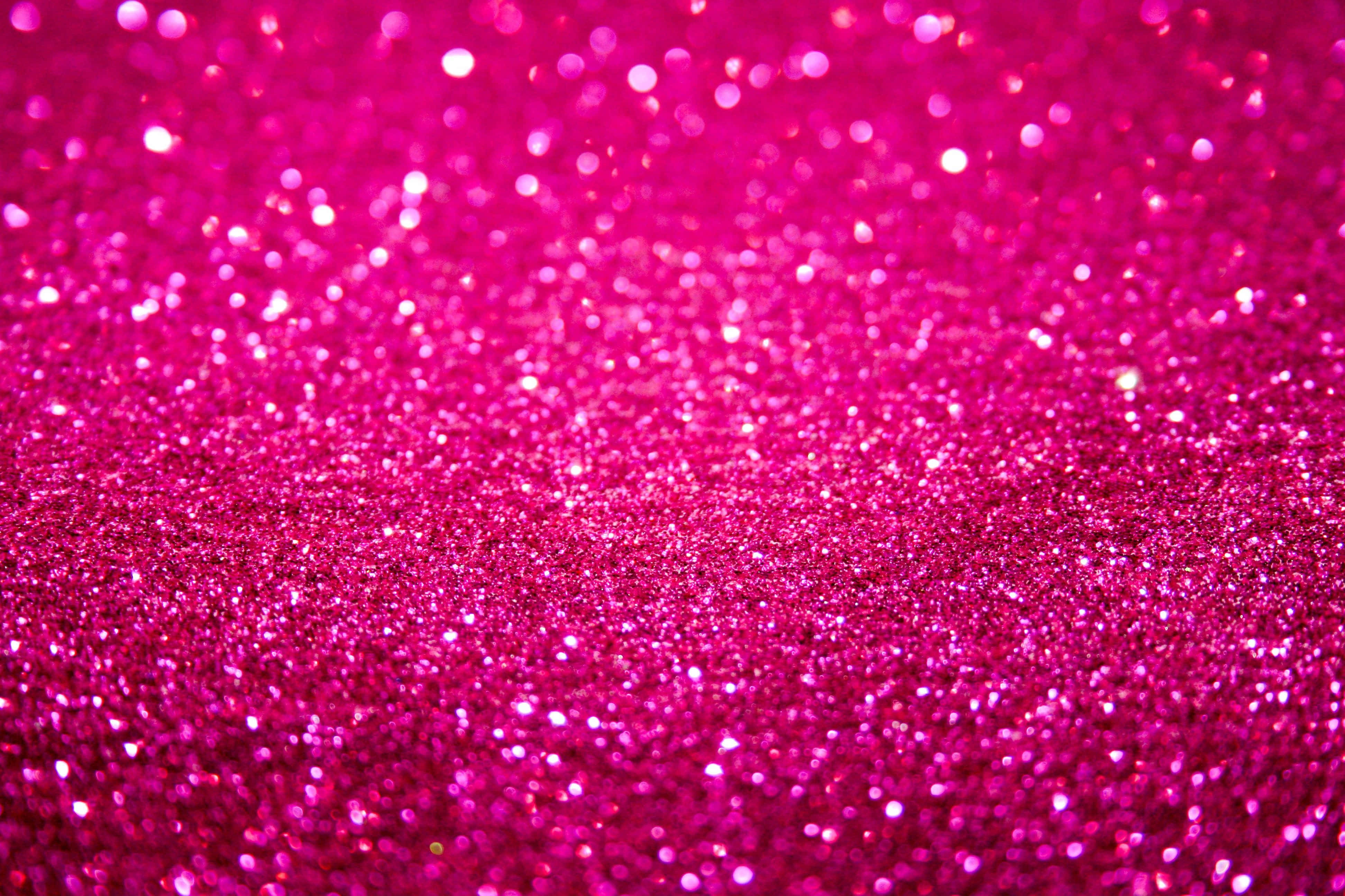 Pink Sparkles 桌布 壁紙 — 充滿活力的粉紅色閃粉紋理，帶有閃爍的散景高光和柔和的漸變模糊效果。
