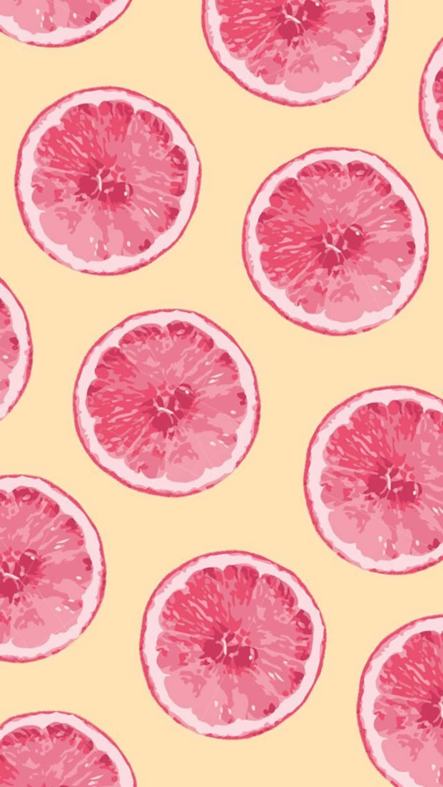 Pink Grapefruit 桌布 壁紙 — 充滿活力的粉紅西柚片在柔和的黃色背景上以重複圖案排列。