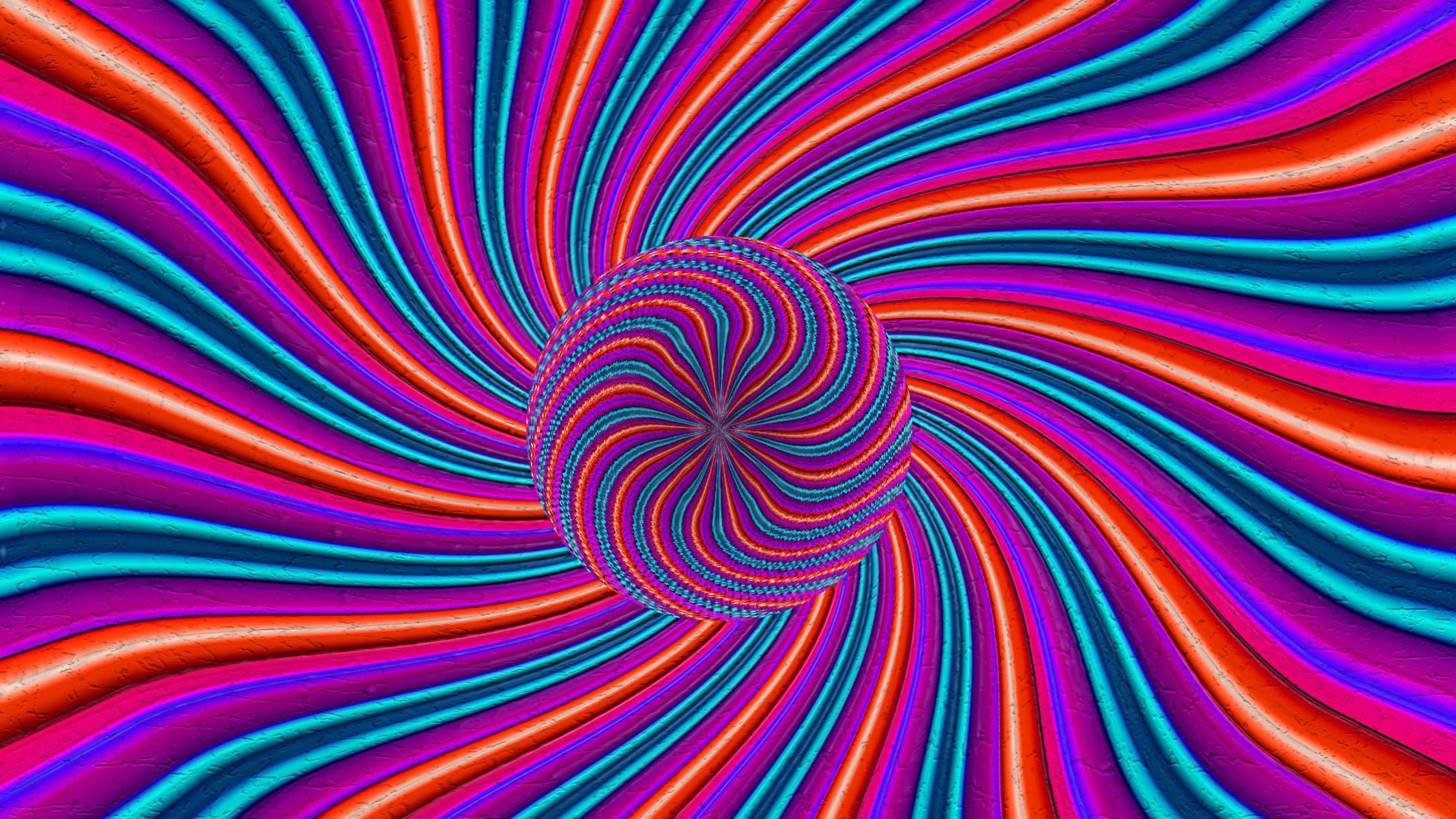 Illusion 桌布 壁紙 — 充滿活力的紅色、藍綠色和紫色漩渦絲帶匯聚成一個催眠般的中央漩渦，中心是一個帶有紋理的球體核心。