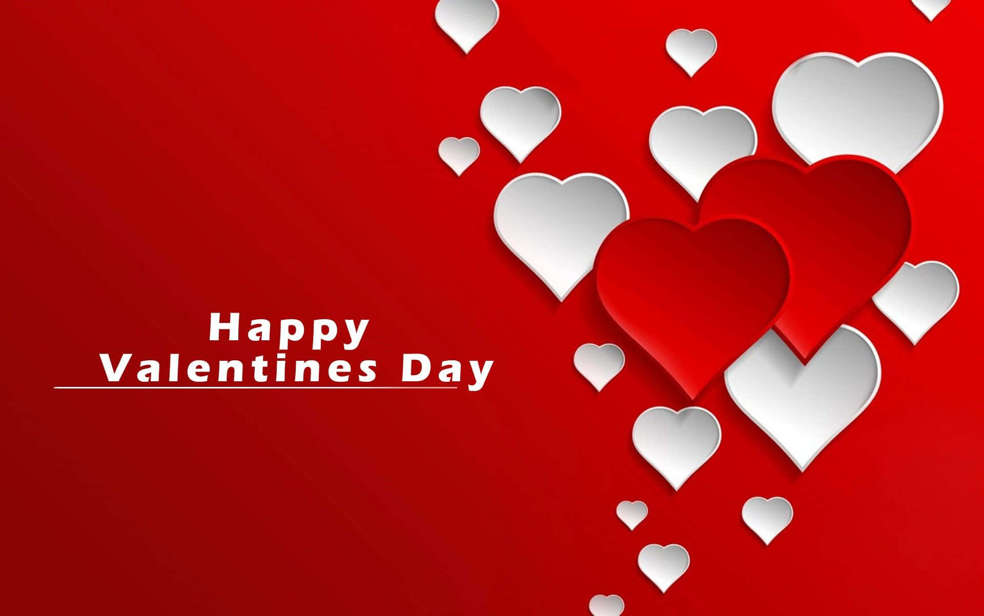 Happy Valentines Day 桌布 壁紙 — 充滿活力的紅色背景，帶有層疊的紙心心及「Happy Valentines Day」文字。