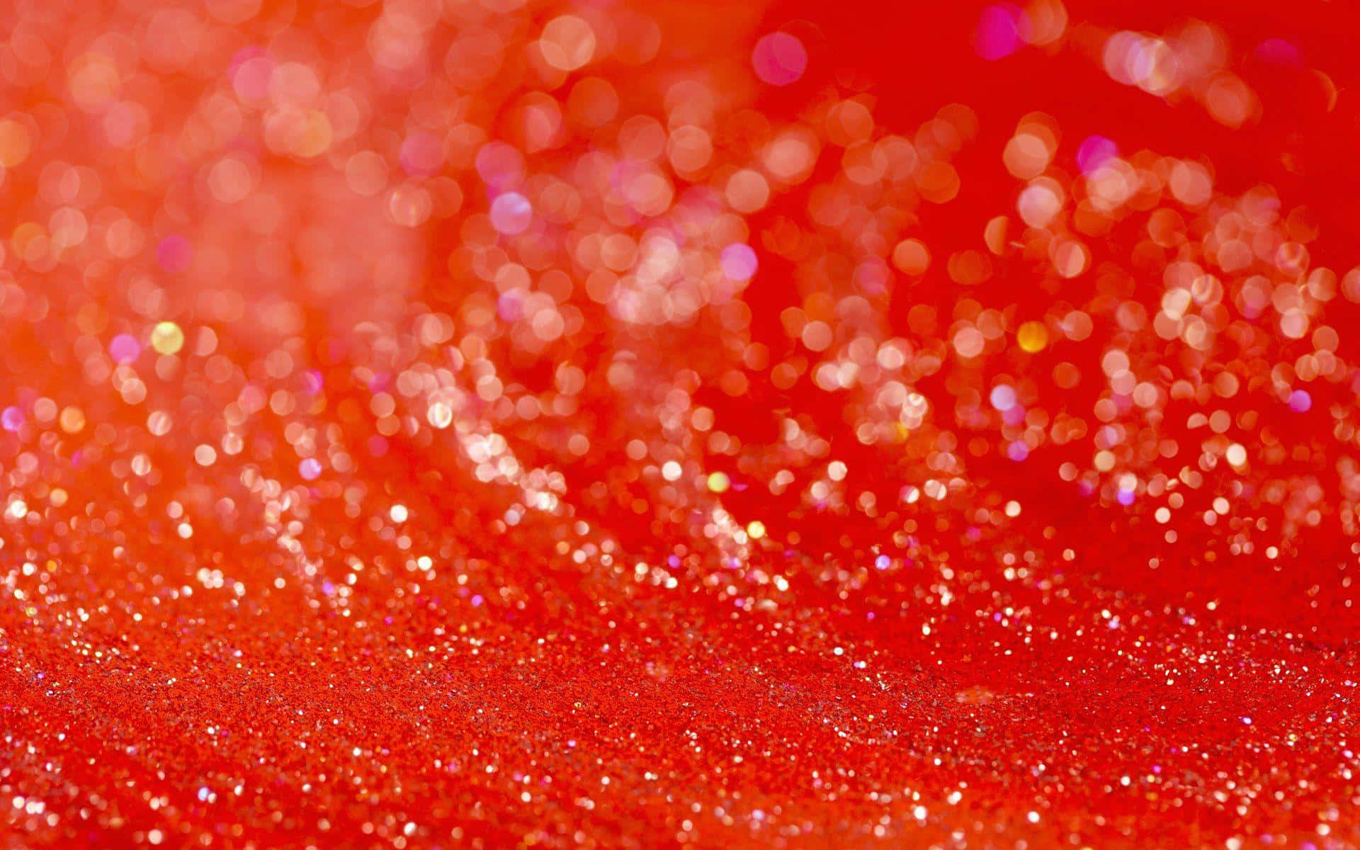 Orange Glitter 桌布 壁紙 — 充滿活力的紅色閃粉表面，搭配散景光效，營造出閃爍的節日質感。