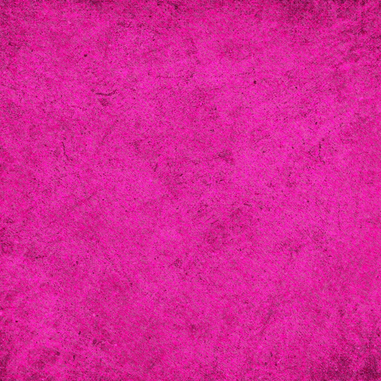 Pink Texture 桌布 壁紙 — 充滿活力的紫紅色紋理表面，帶有微妙的深色斑點和不均勻的顆粒圖案。