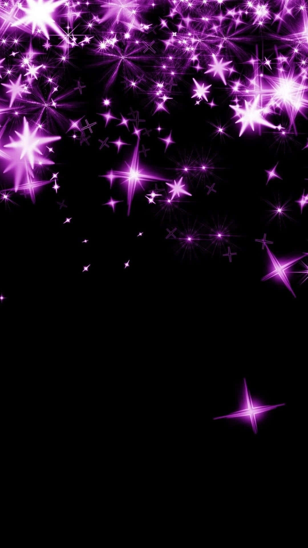 Pink Stars 桌布 壁紙 — 充滿活力的紫色星爆在深邃的黑色虛空中爆炸，創造出令人眼花繚亂的宇宙奇觀。