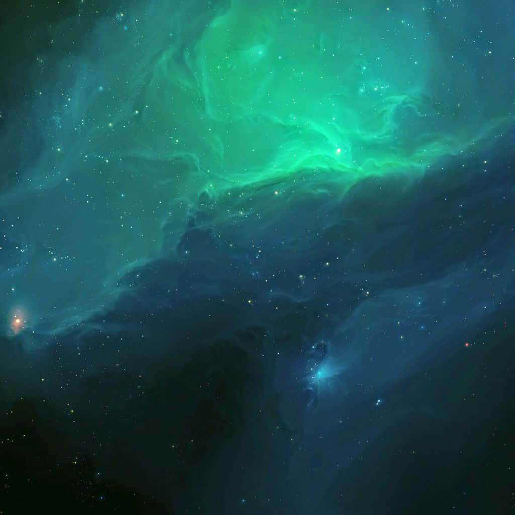 Green Galaxy 桌布 壁紙 — 充滿活力的綠色和藍綠色星雲雲團在宇宙廣闊的星場中旋轉。