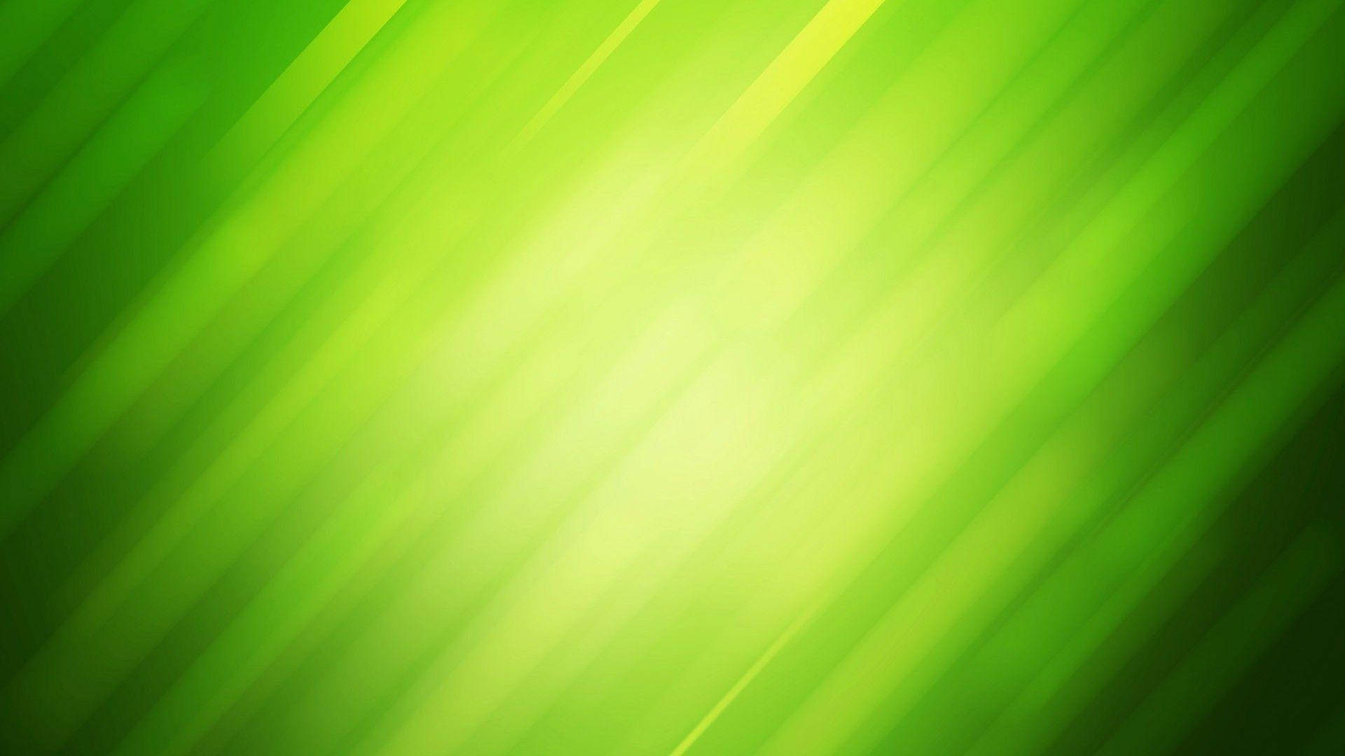 藝術 桌布 壁紙 — 充滿活力的綠色對角光線從明亮的中心向漸變背景輻射。