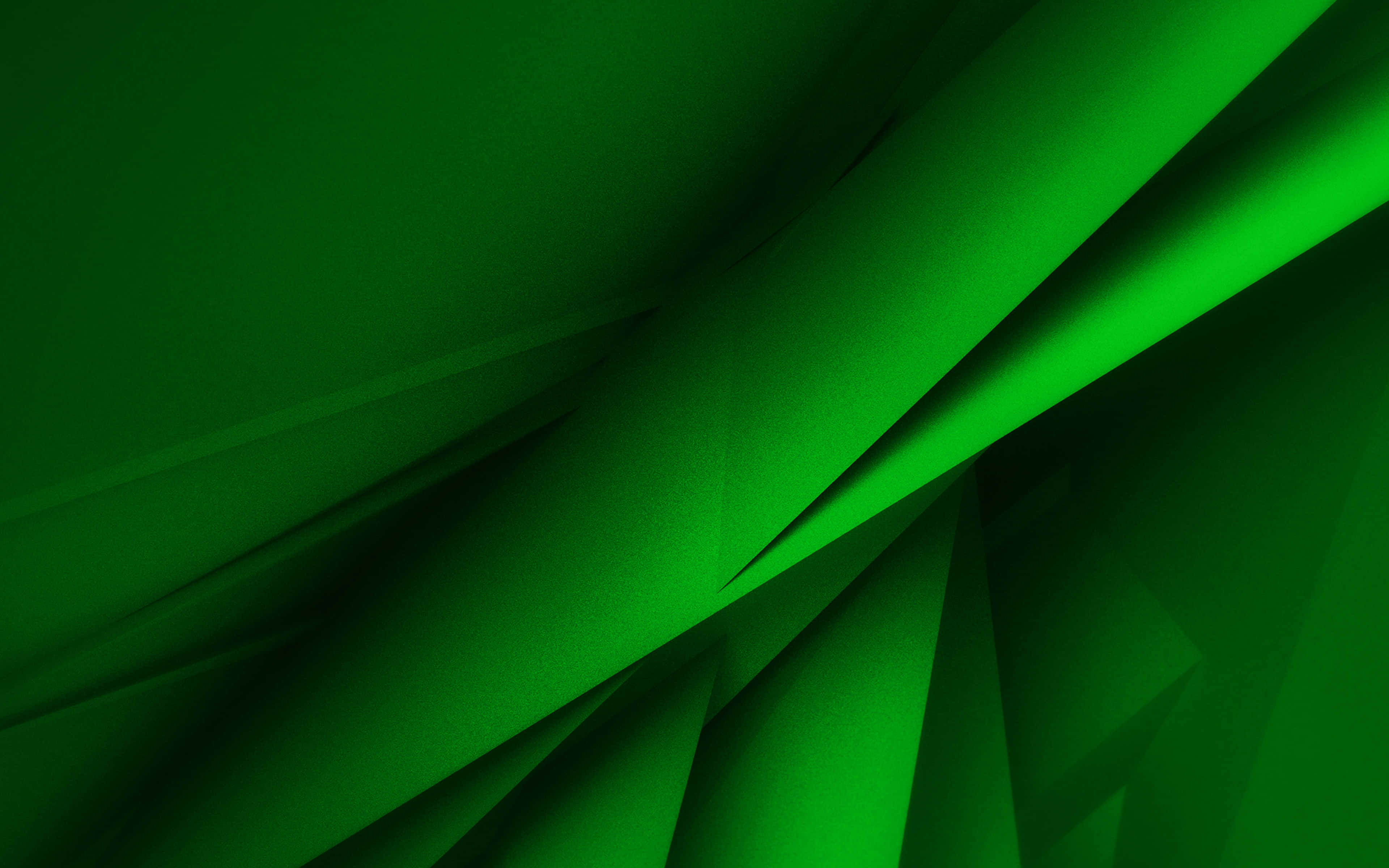 Green Geometric 桌布 壁紙 — 充滿活力的綠色抽象褶皺營造出具有銳利陰影和發光高光的動態幾何圖案。