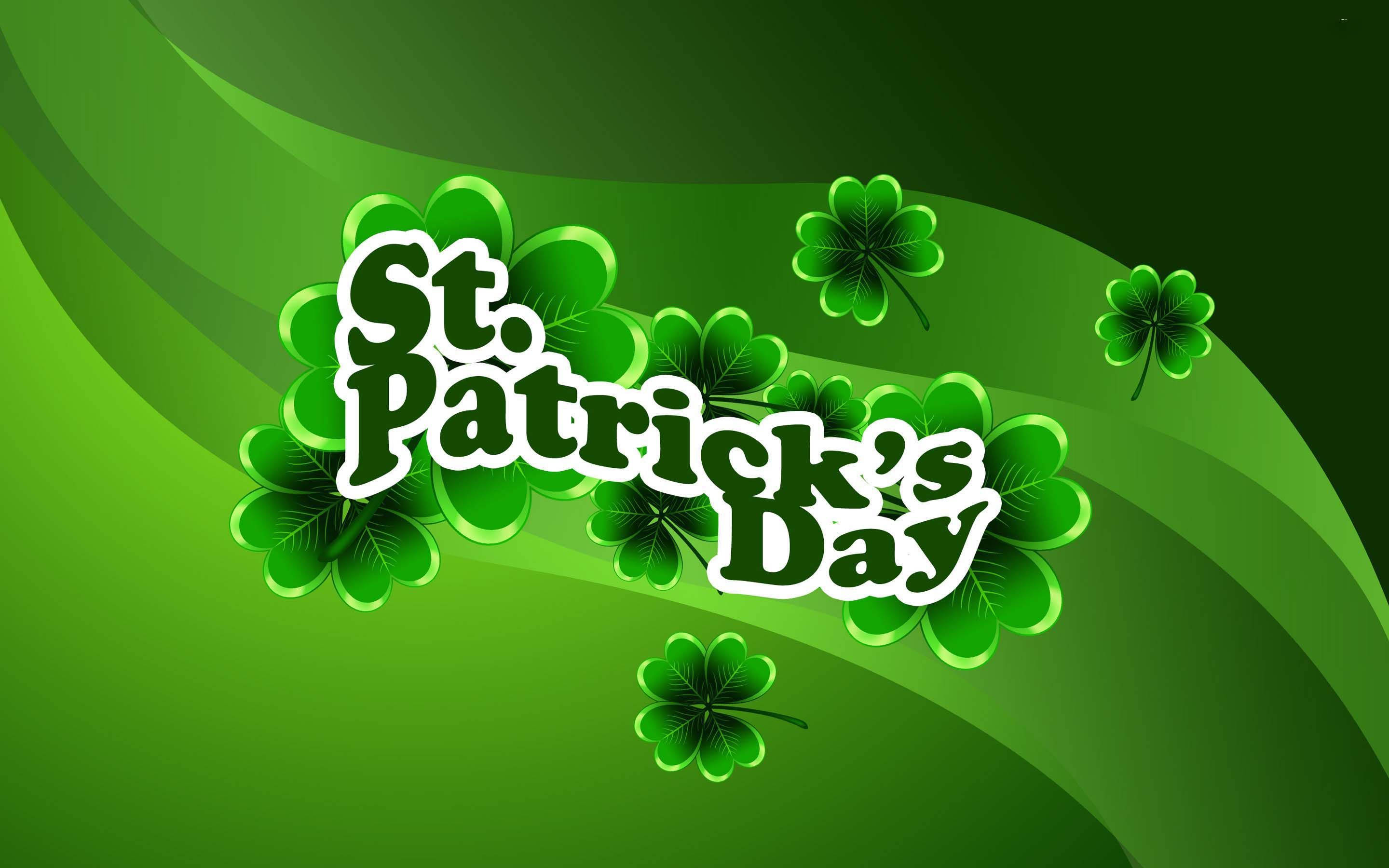 St Patrick's Day 桌布 壁紙 — 充滿活力的綠色聖帕特里克節文字，被三葉草環繞，背景為漸變色。