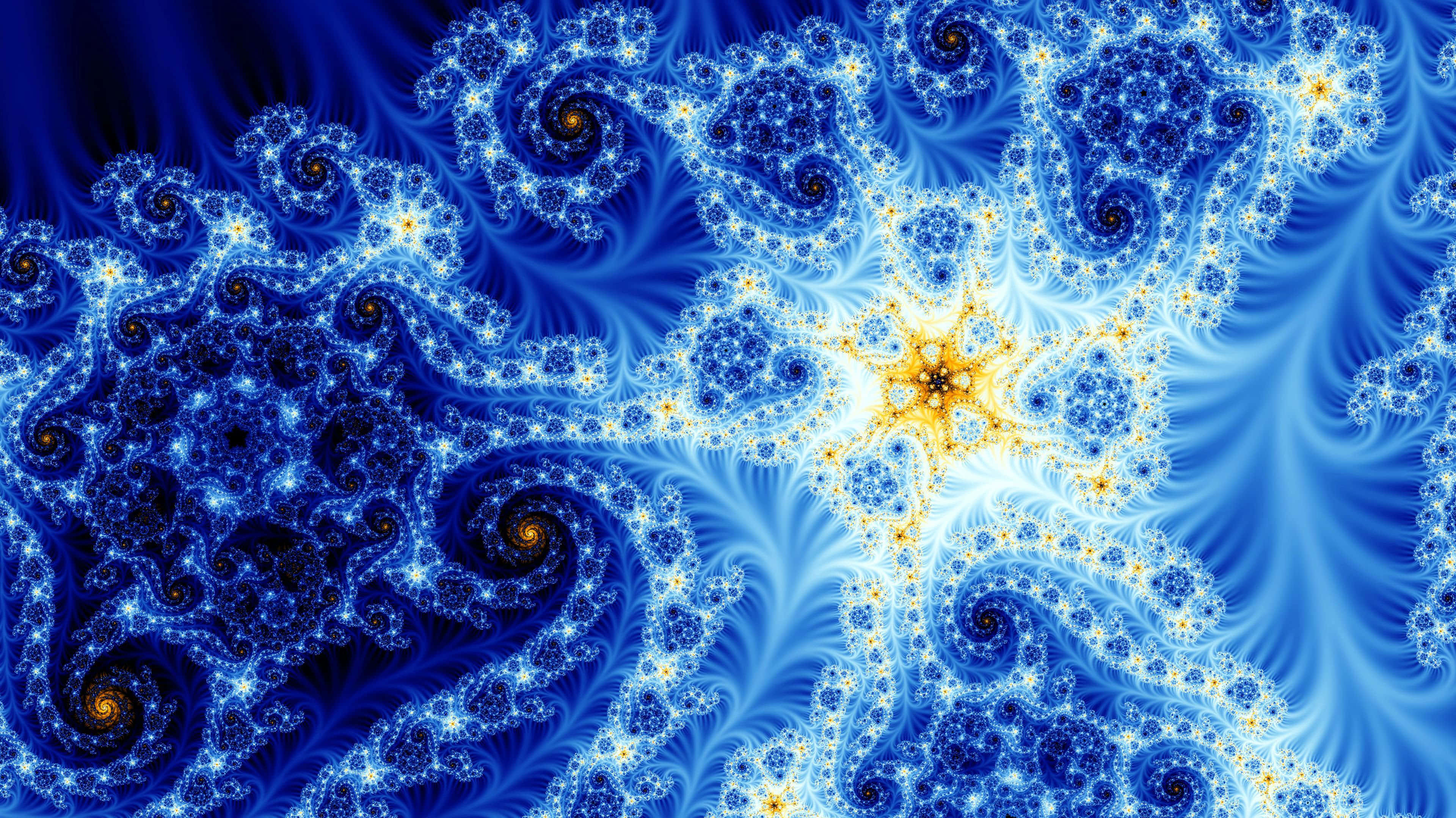 Psychedelic Fractals 桌布 壁紙 — 充滿活力的藍色分形圖案在深色背景上與金色中心旋轉，創造出迷人的數位藝術作品。