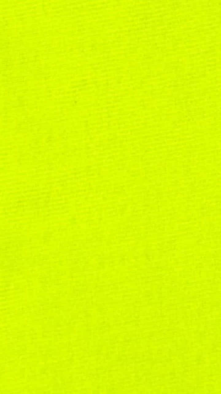 Neon Colors 桌布 壁紙 — 充滿活力的螢光黃色紋理布料以一致的編織圖案填滿畫面。