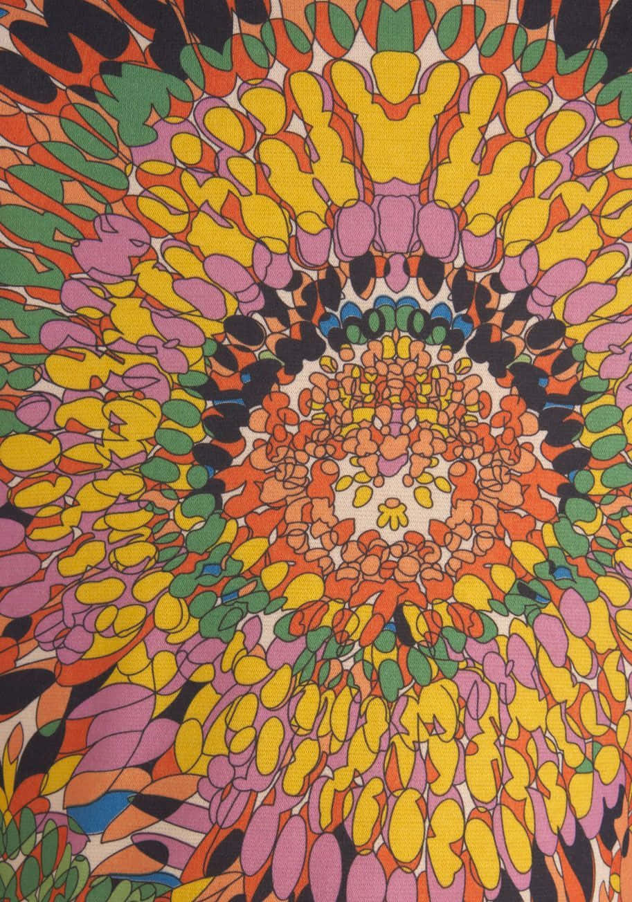 Psychedelic 70s Aesthetic 桌布 壁紙 — 充滿活力的迷幻花卉圖案在紋理織物上以鮮豔色彩的同心層向外輻射。