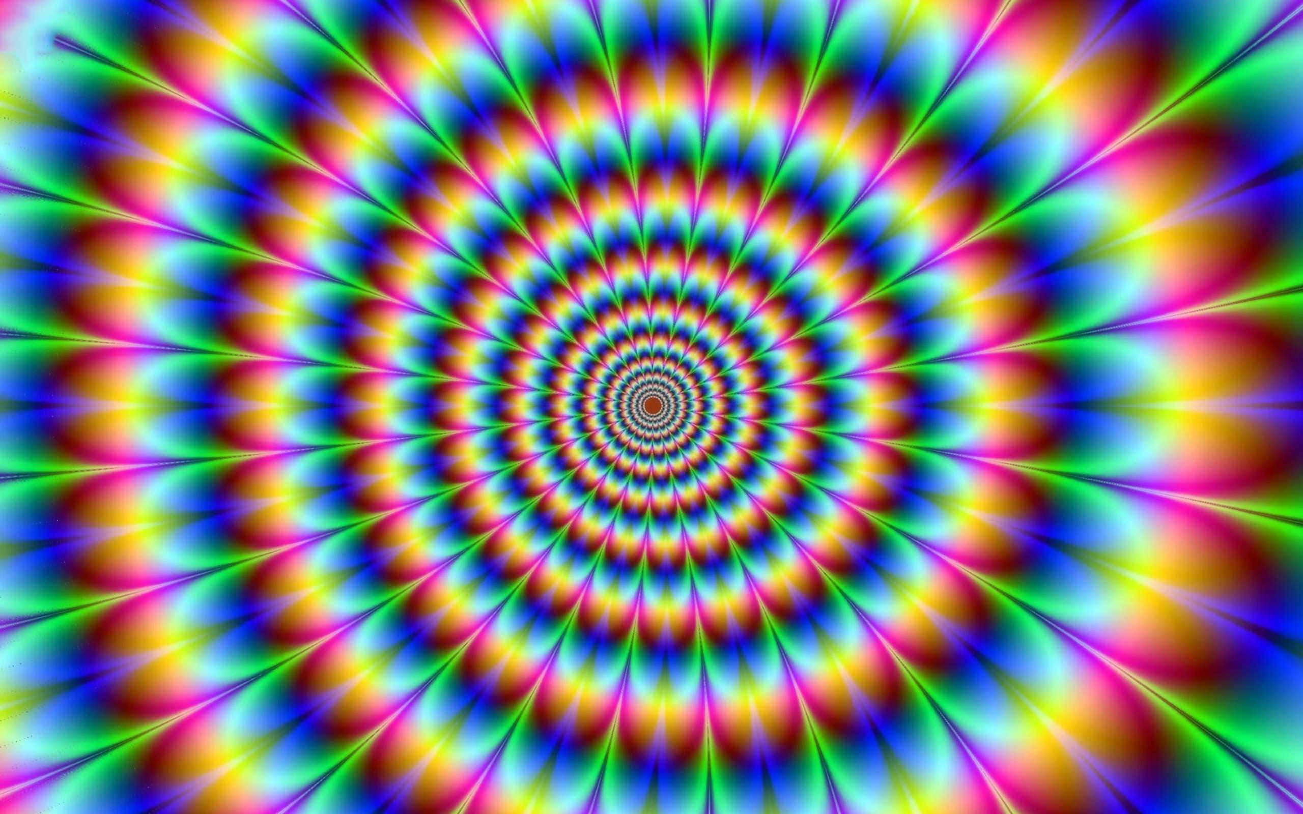 幻覺 桌布 壁紙 — 充滿活力的迷幻螺旋以彩虹色向外輻射，營造出催眠隧道效果。