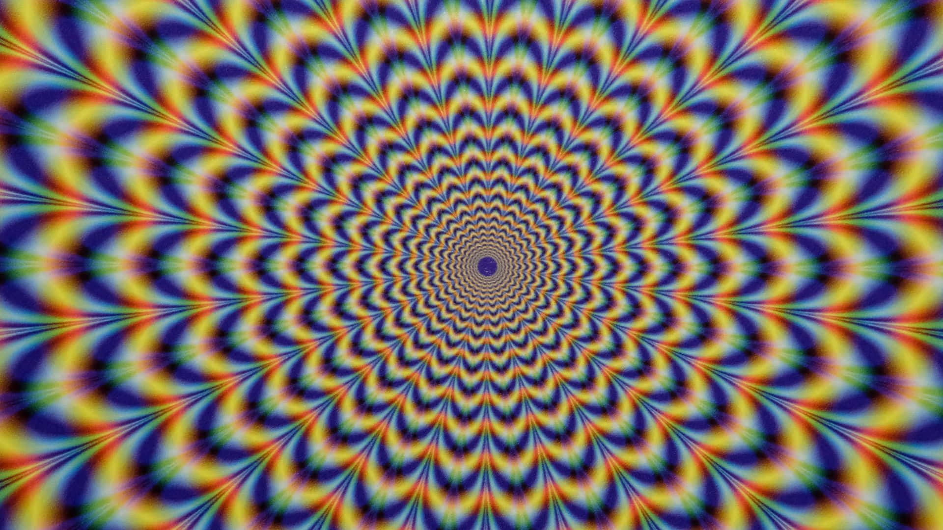 Optical Illusions 桌布 壁紙 — 充滿活力的迷幻螺旋圖案向外輻射，帶有催眠般的彩虹色調，創造出迷人的視錯覺。