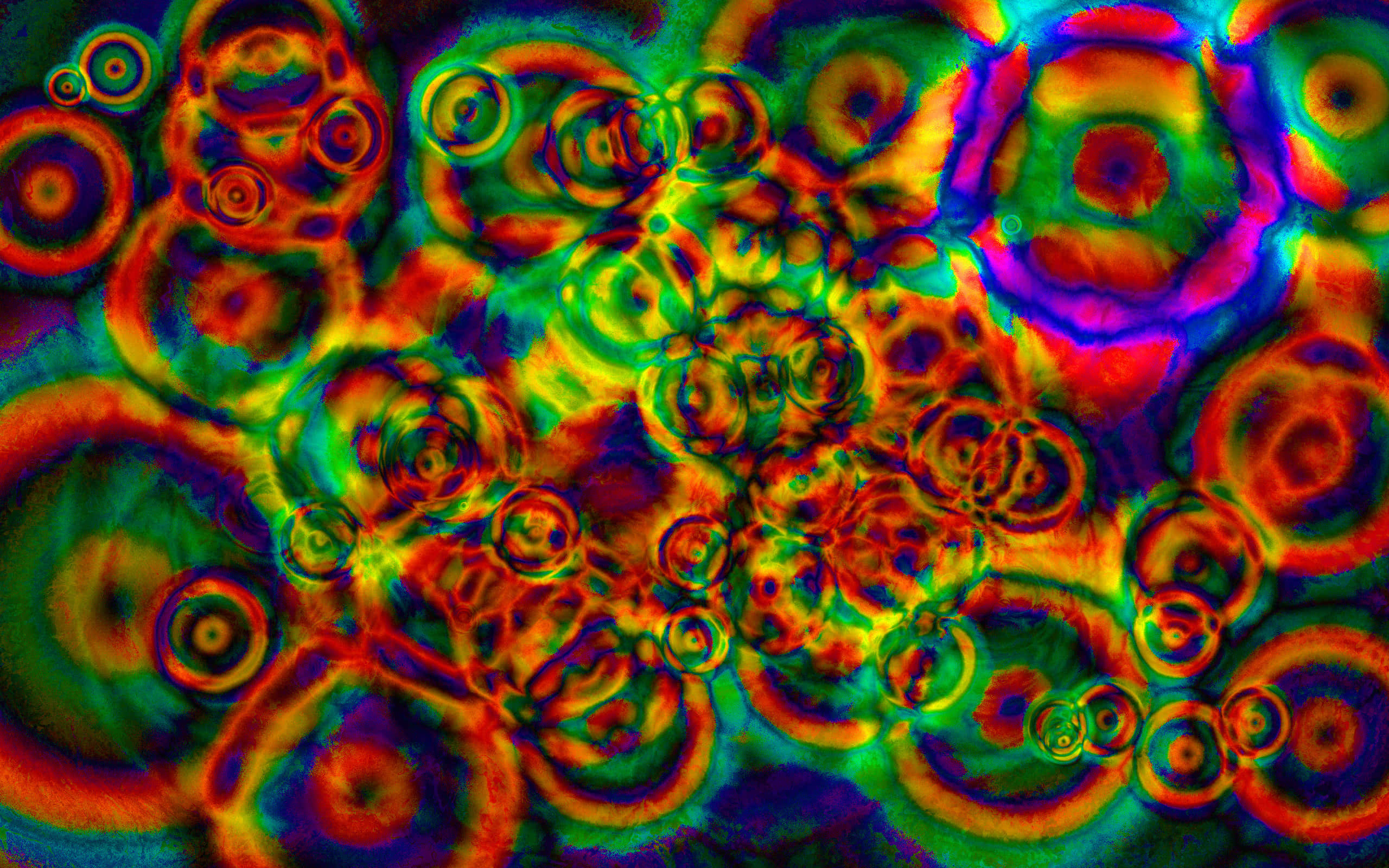 Trippy 3d Art 桌布 壁紙 — 充滿活力的迷幻霓虹色彩漩渦，在迷人的抽象構圖中形成發光的圓形圖案。