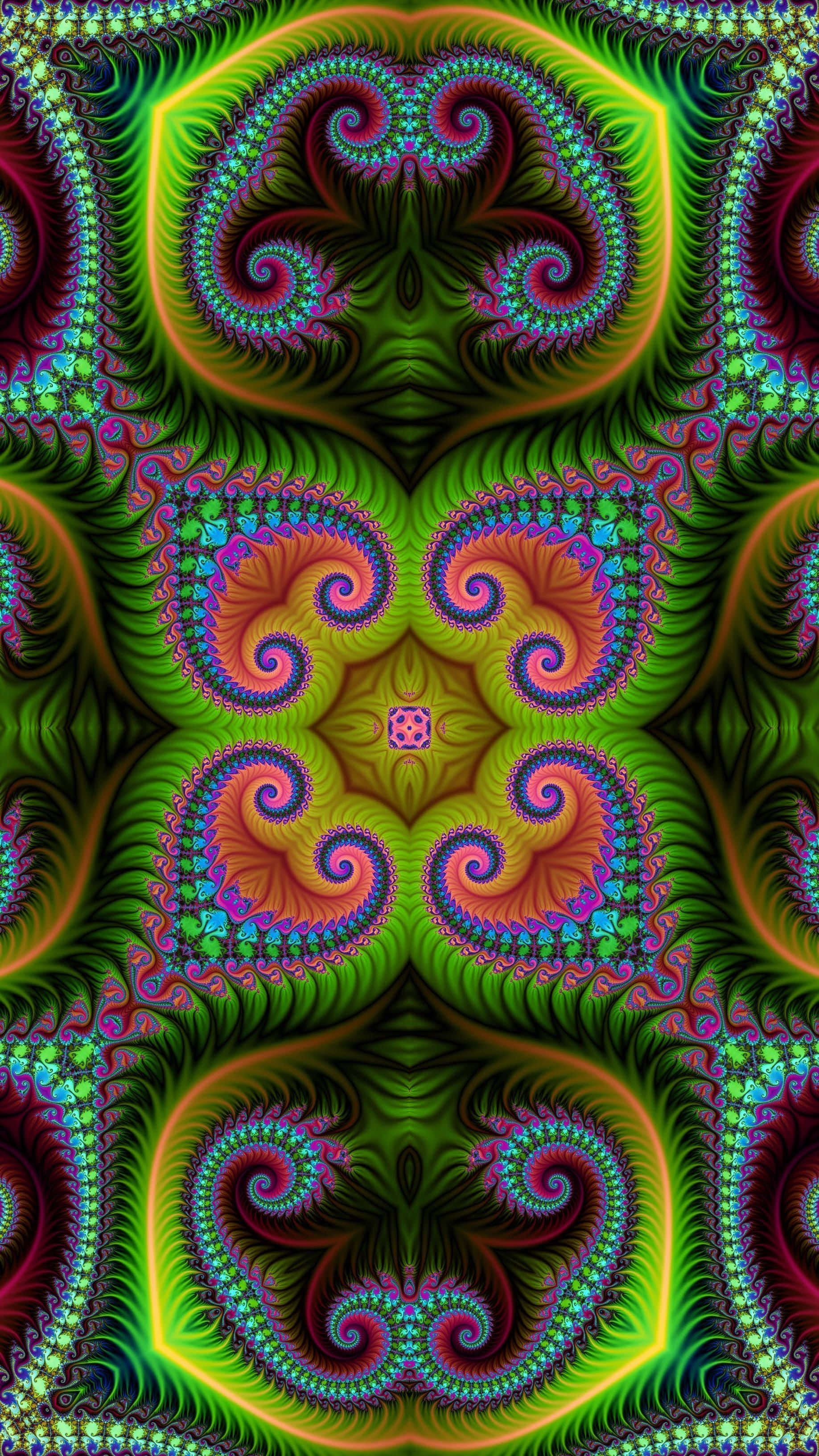 Trippy Fractals 桌布 壁紙 — 充滿活力的霓虹分形圖案以萬花筒般的對稱性旋轉，帶有發光的綠色、橙色和紫色色調。